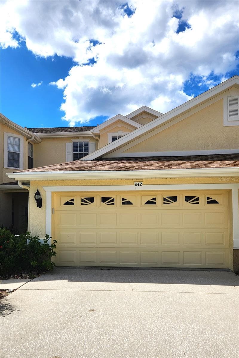 Double Garage with parking space. - 642 SPRING LAKE CIR, TARPON SPRINGS