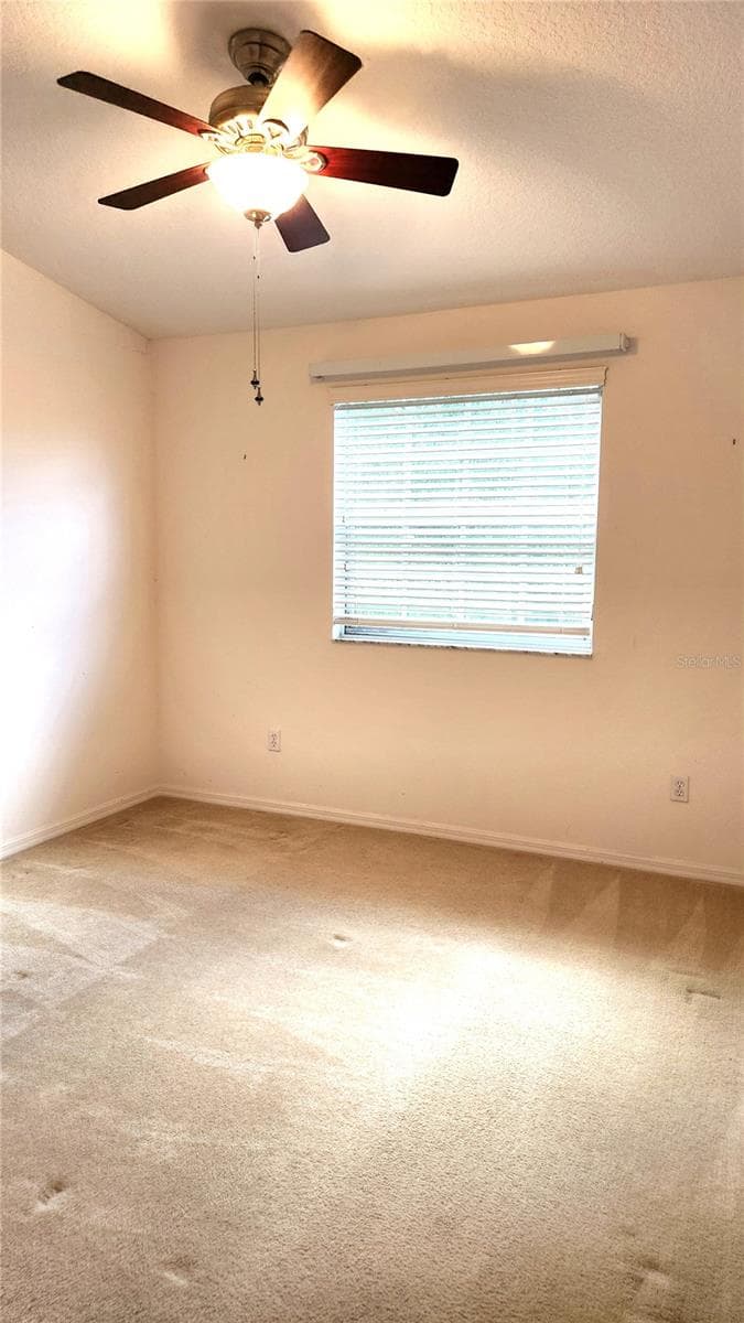 3rd Bedroom facing rear of home. - 642 SPRING LAKE CIR, TARPON SPRINGS