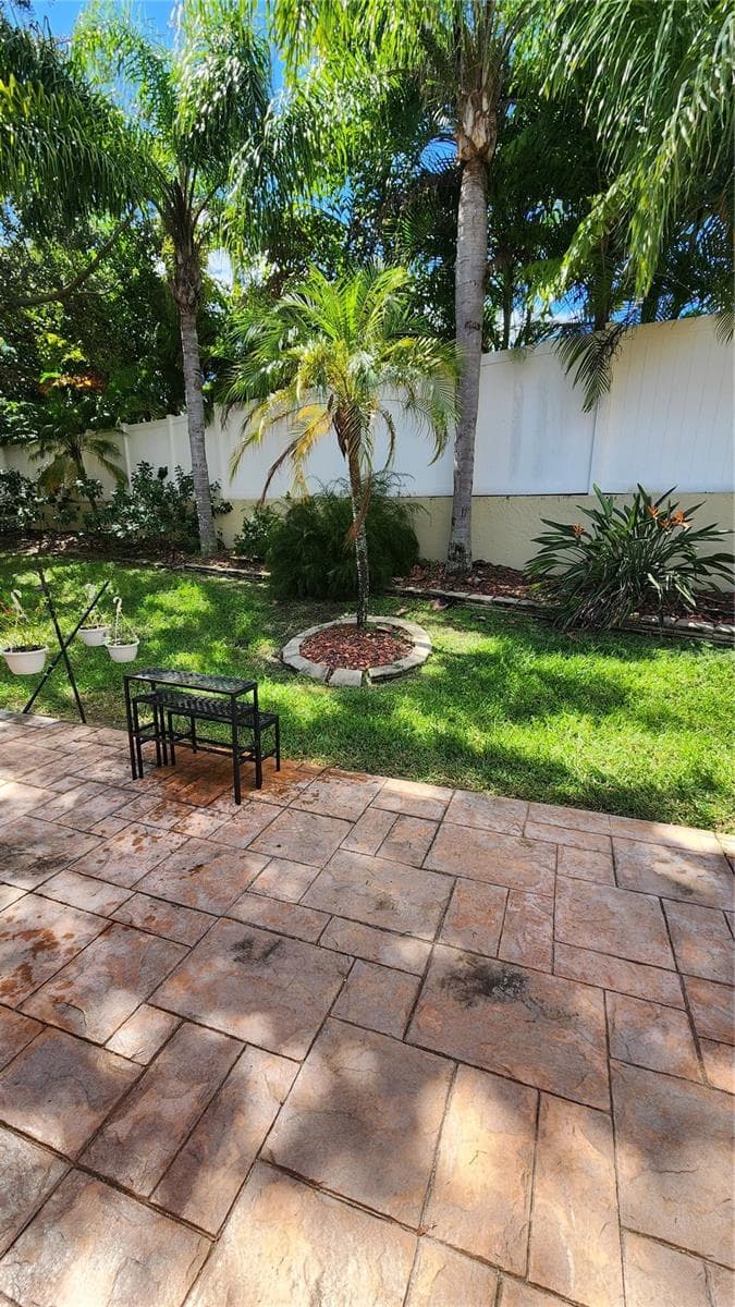 Paved area outside patio. - 642 SPRING LAKE CIR, TARPON SPRINGS