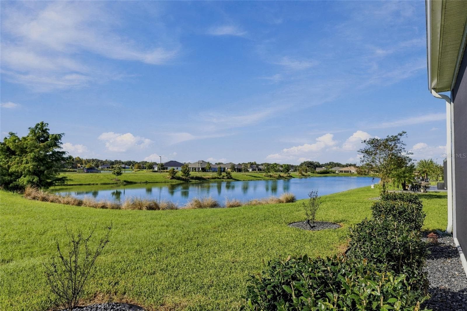 Back Yard toward pond - 614 LAKE CREEK CIR, THE VILLAGES