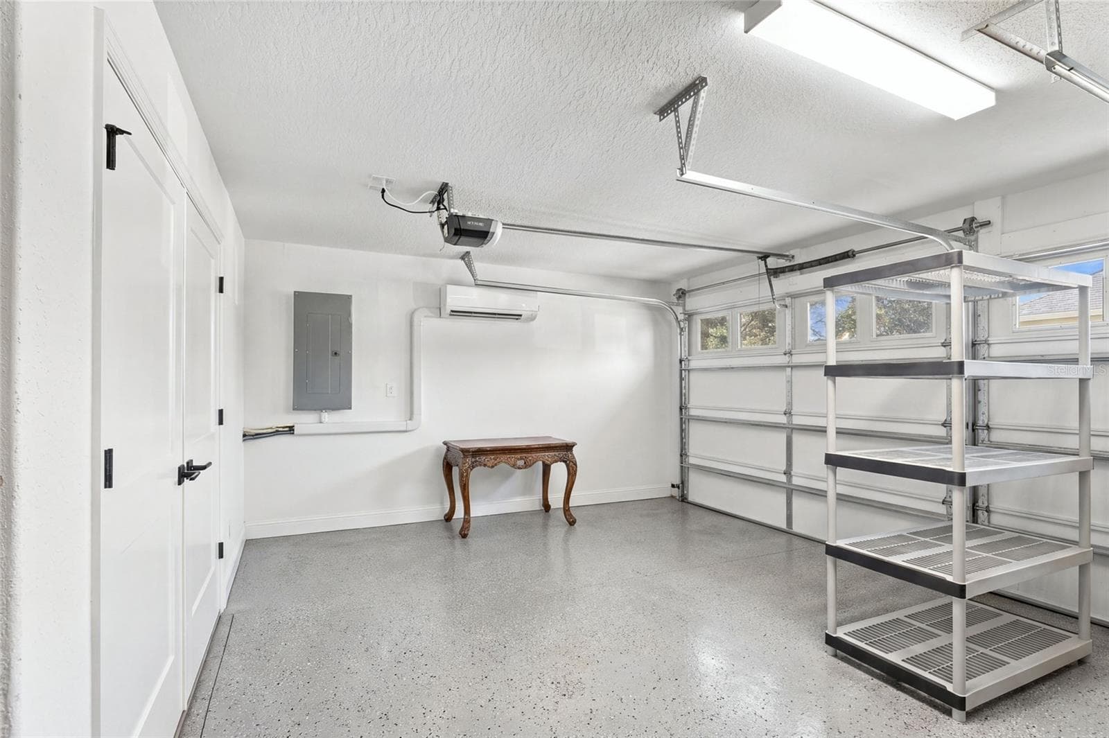 Garage's Got Cart area with utility closet to left - 614 LAKE CREEK CIR, THE VILLAGES
