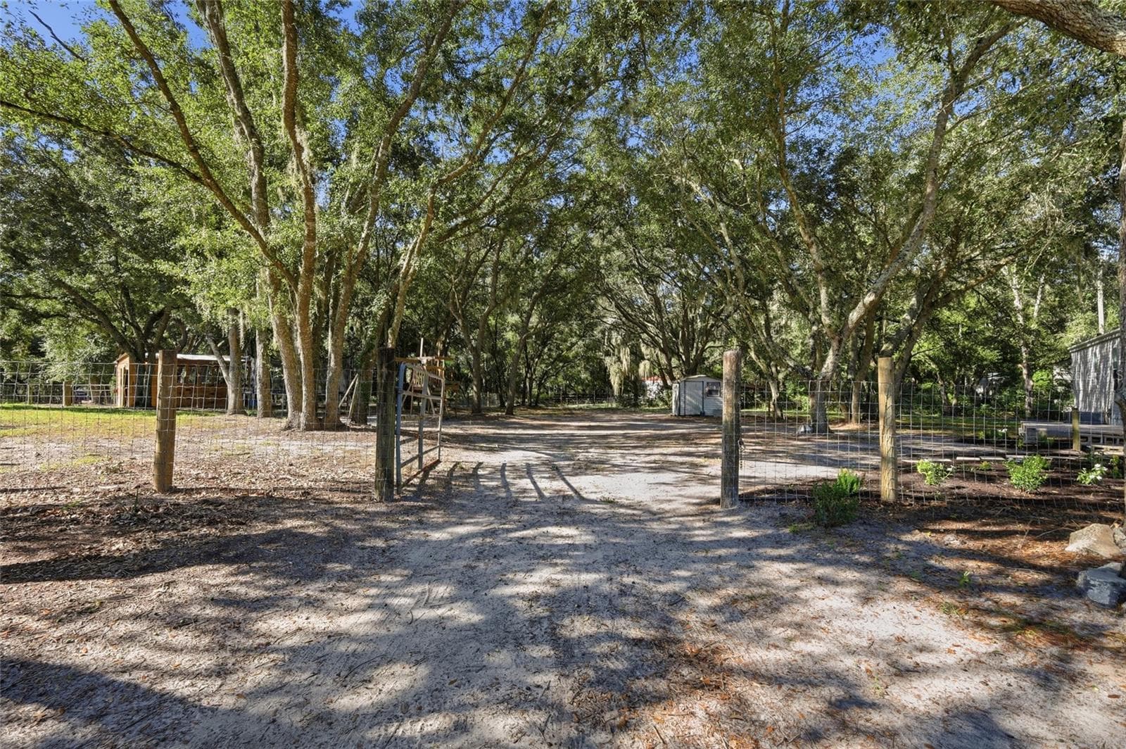 Gate to back of home 1 large of 3 large fenced in areas - 2138 LAKE ELLA RD, FRUITLAND PARK