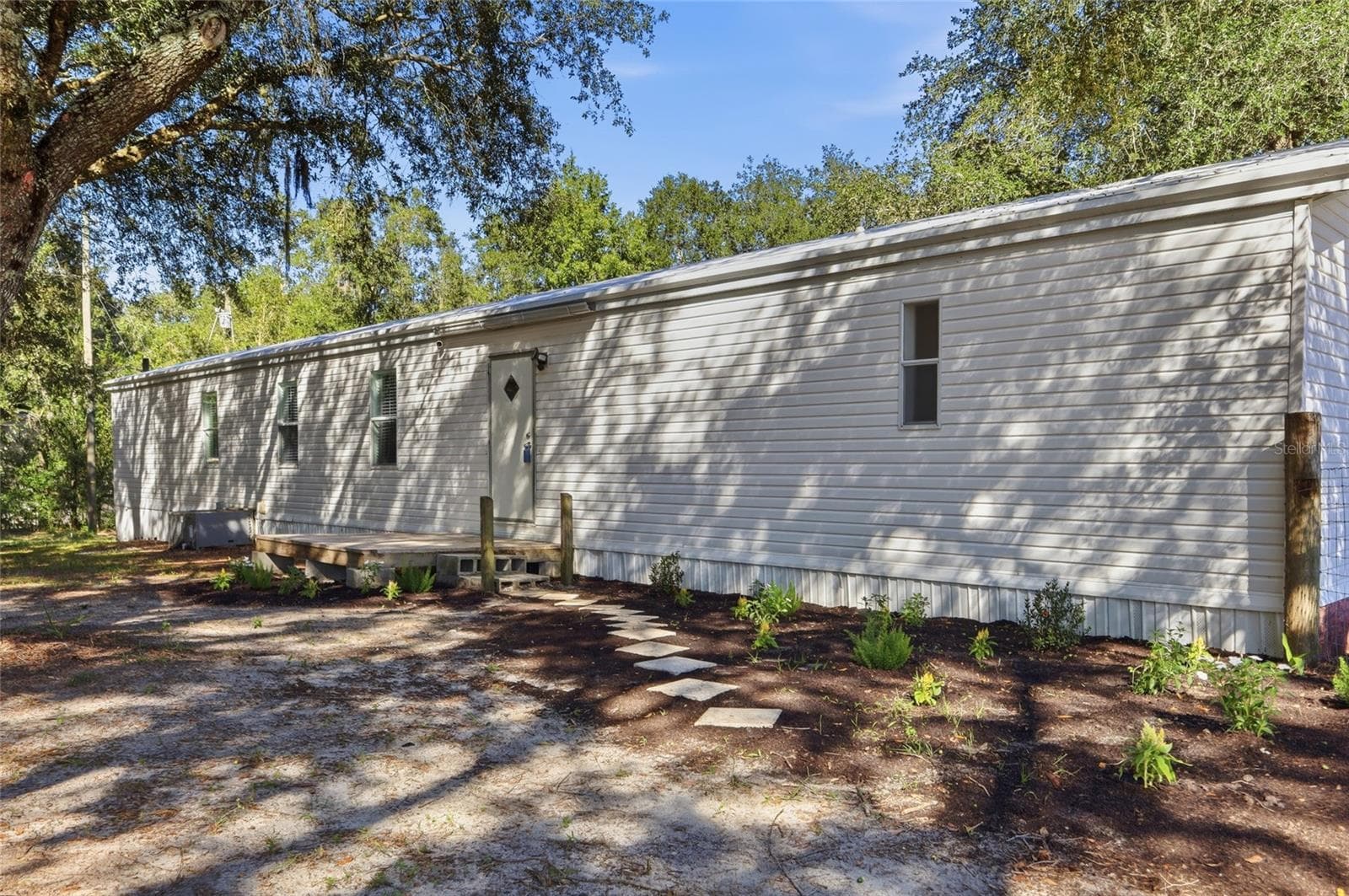 back of home - 2138 LAKE ELLA RD, FRUITLAND PARK