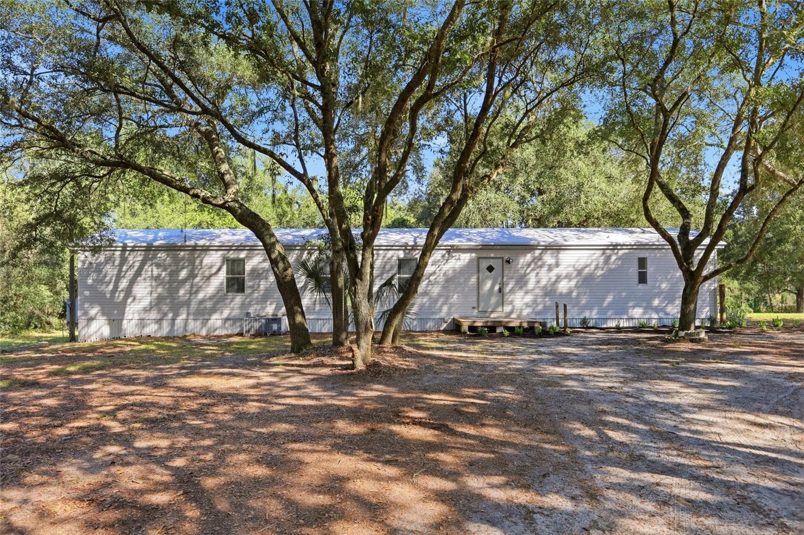 back of home - 2138 LAKE ELLA RD, FRUITLAND PARK
