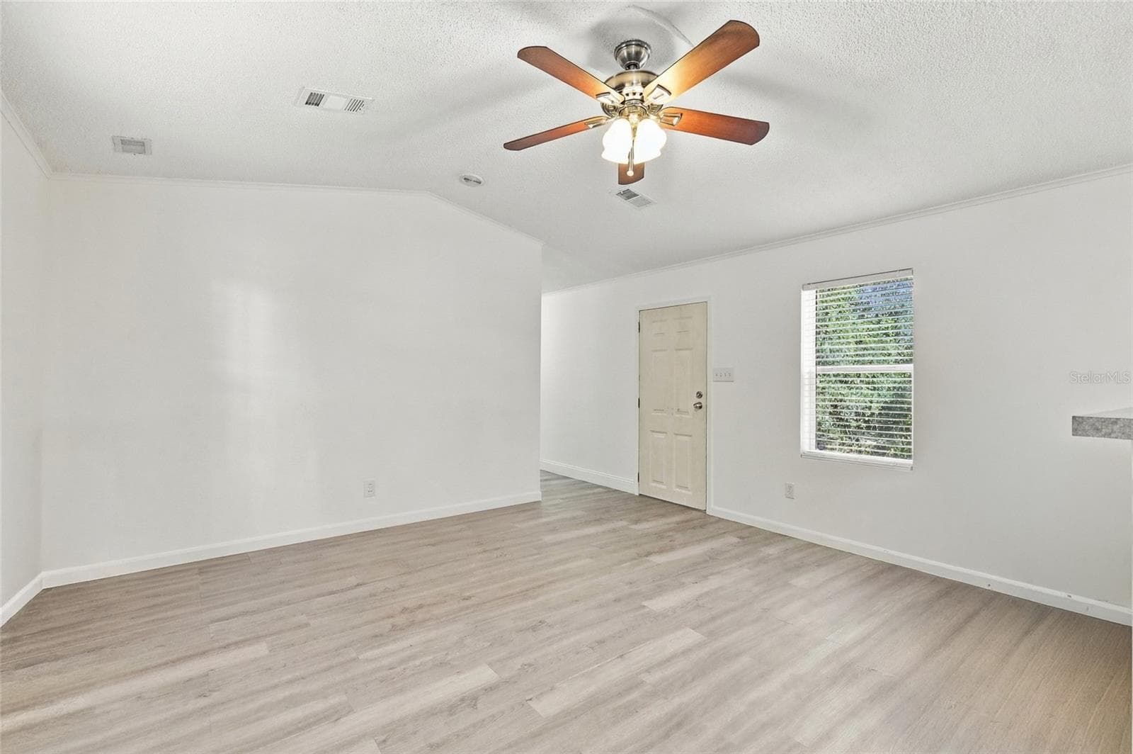 Front door. View from dining room - 2138 LAKE ELLA RD, FRUITLAND PARK