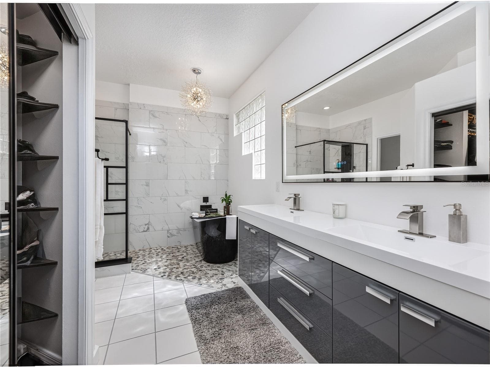 Spa-like primary bathroom featuring modern finishes and a relaxing atmosphere. - 1854 VISTA ROYALE BLVD, ORLANDO