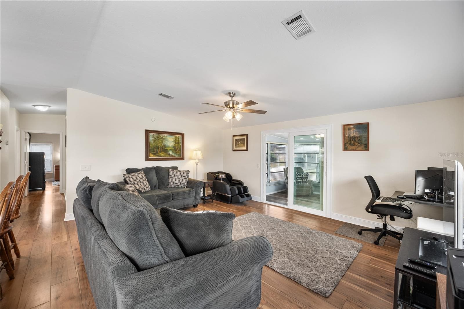Living room open to Florida room - 1502 LONGBOW DR, LAKELAND