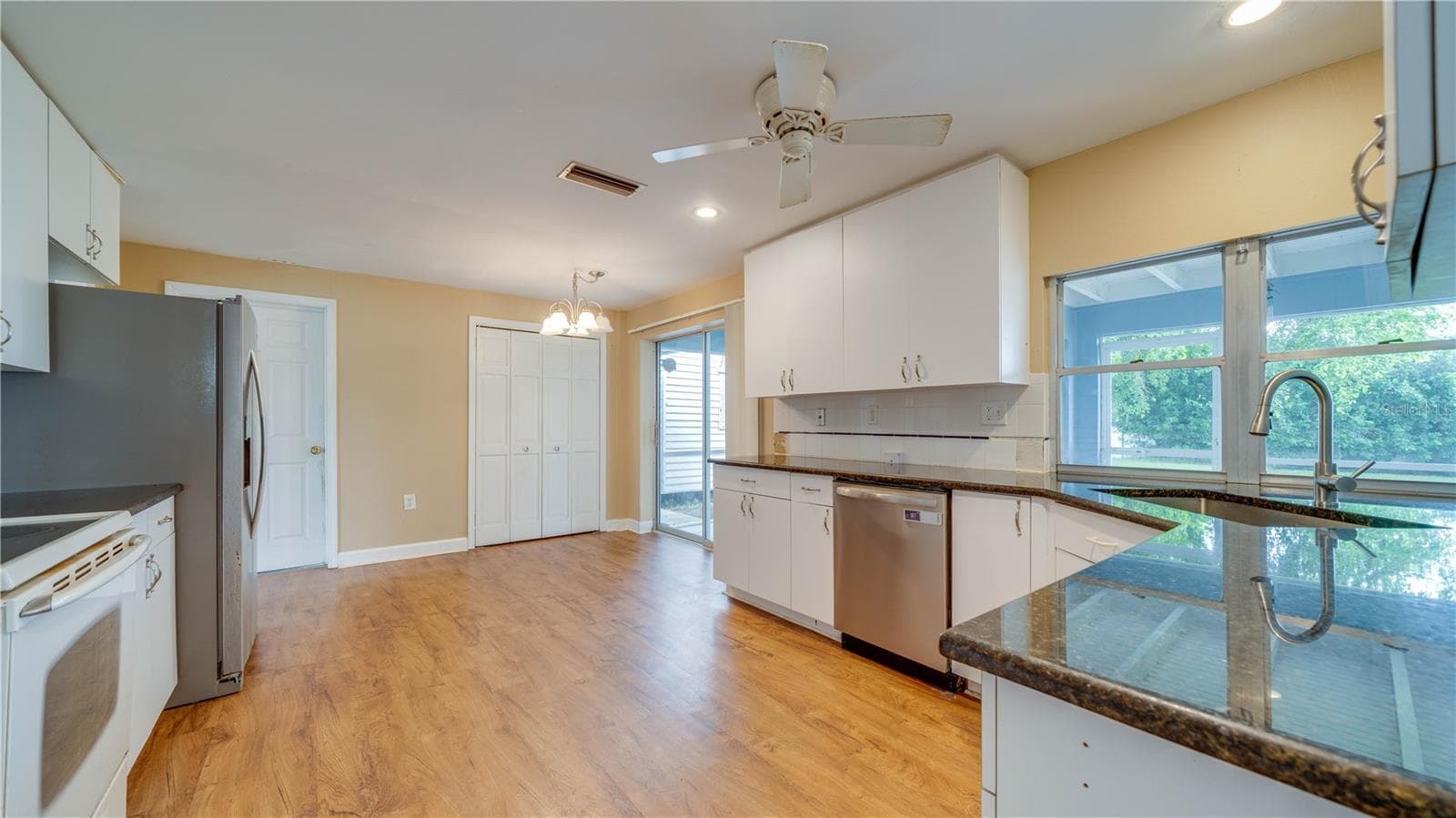 Notice the large pantry and abundant cabinetry. - 909 SE 27TH ST, CAPE CORAL