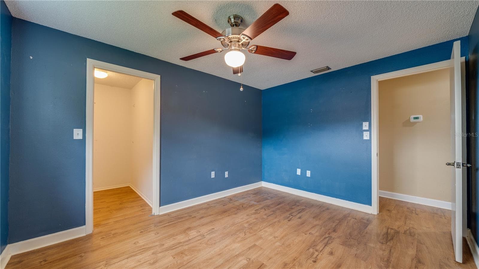 Yes; Bedroom No. 3 also features a walk-in closet. - 909 SE 27TH ST, CAPE CORAL