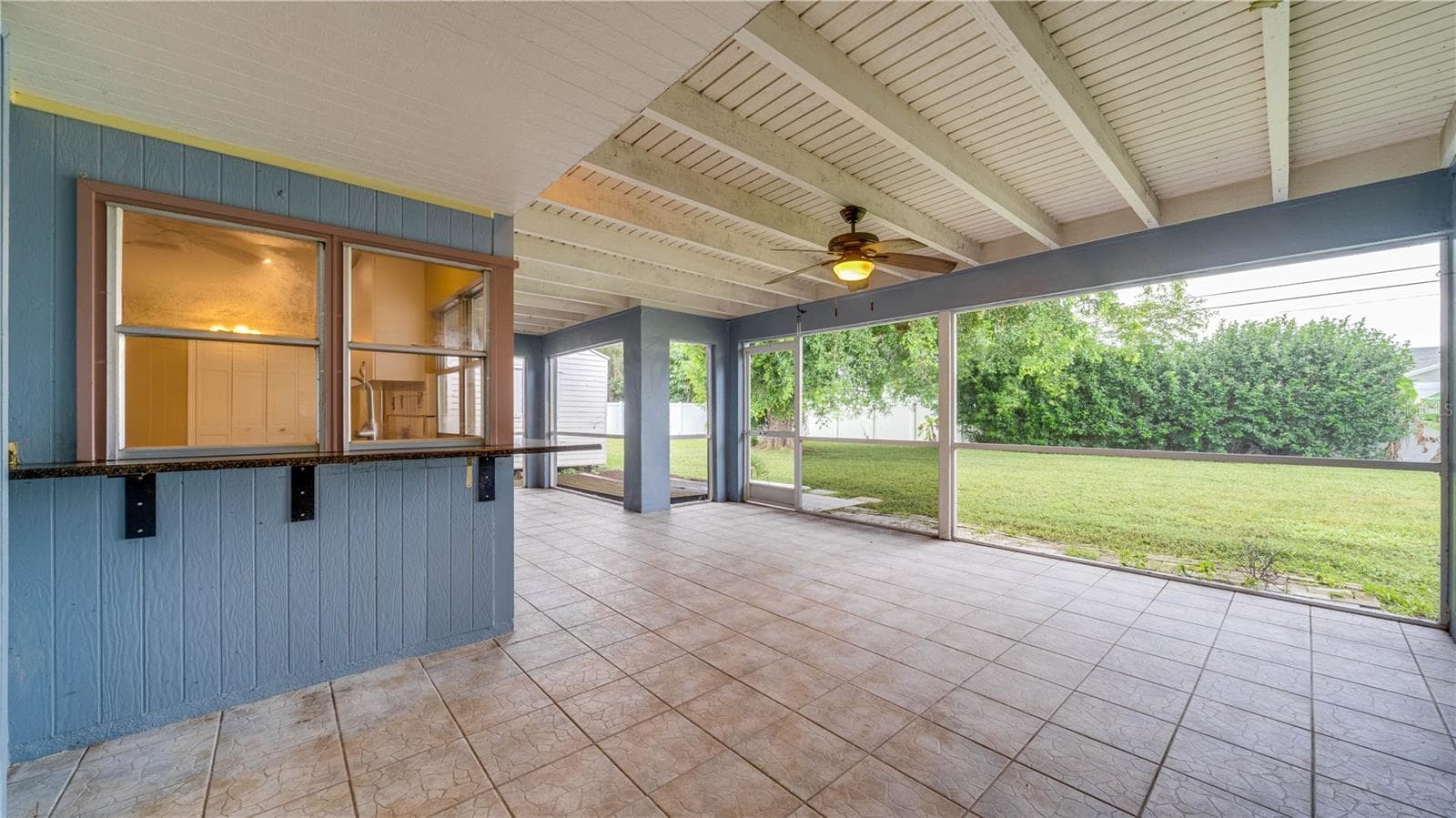This home has a pass thru window from the kitchen to the lanai making outdoor dining easy and convenient. - 909 SE 27TH ST, CAPE CORAL