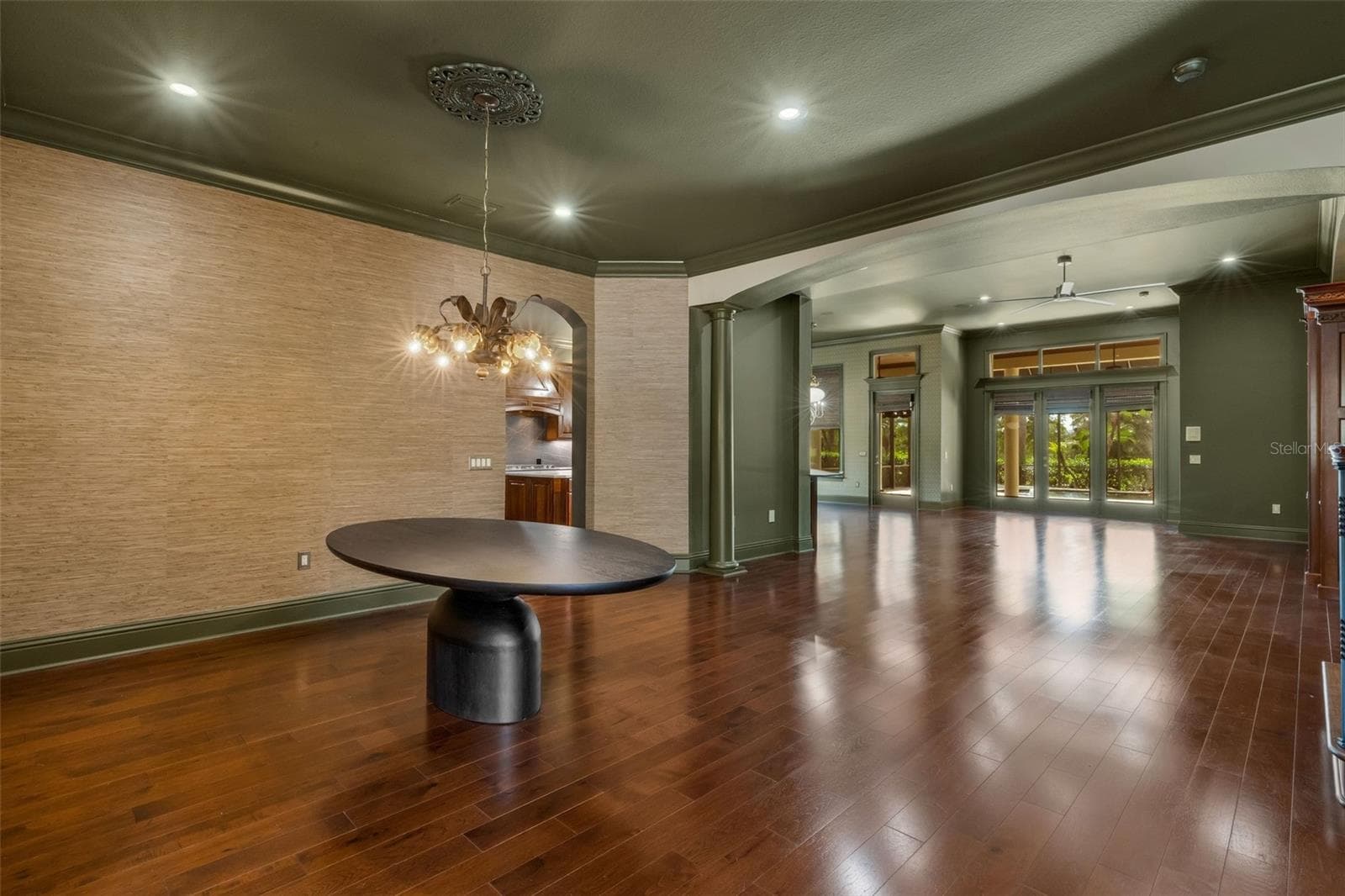 Custom grass cloth covers the wall in many of the formal spaces. - 2734 BELLERIVE DR, LAKELAND