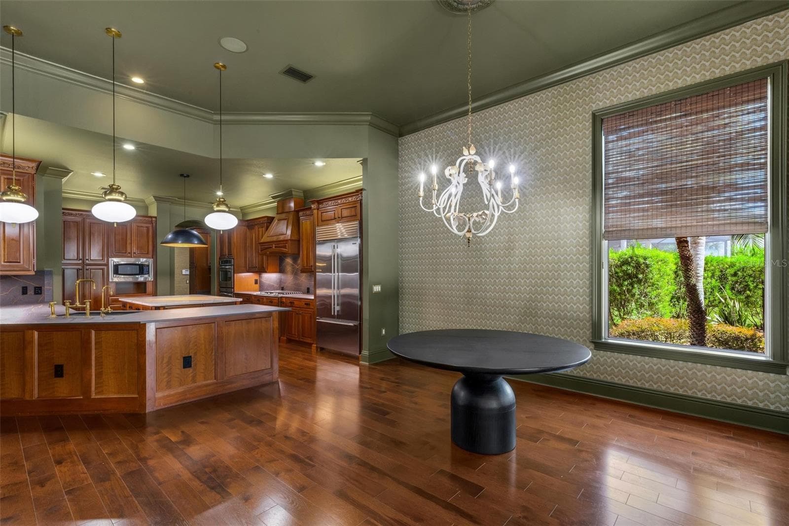 Designer features include new light fixtures, solid wood Kraft Maid cabinets, high-end countertops, built-in appliances and so much more. - 2734 BELLERIVE DR, LAKELAND