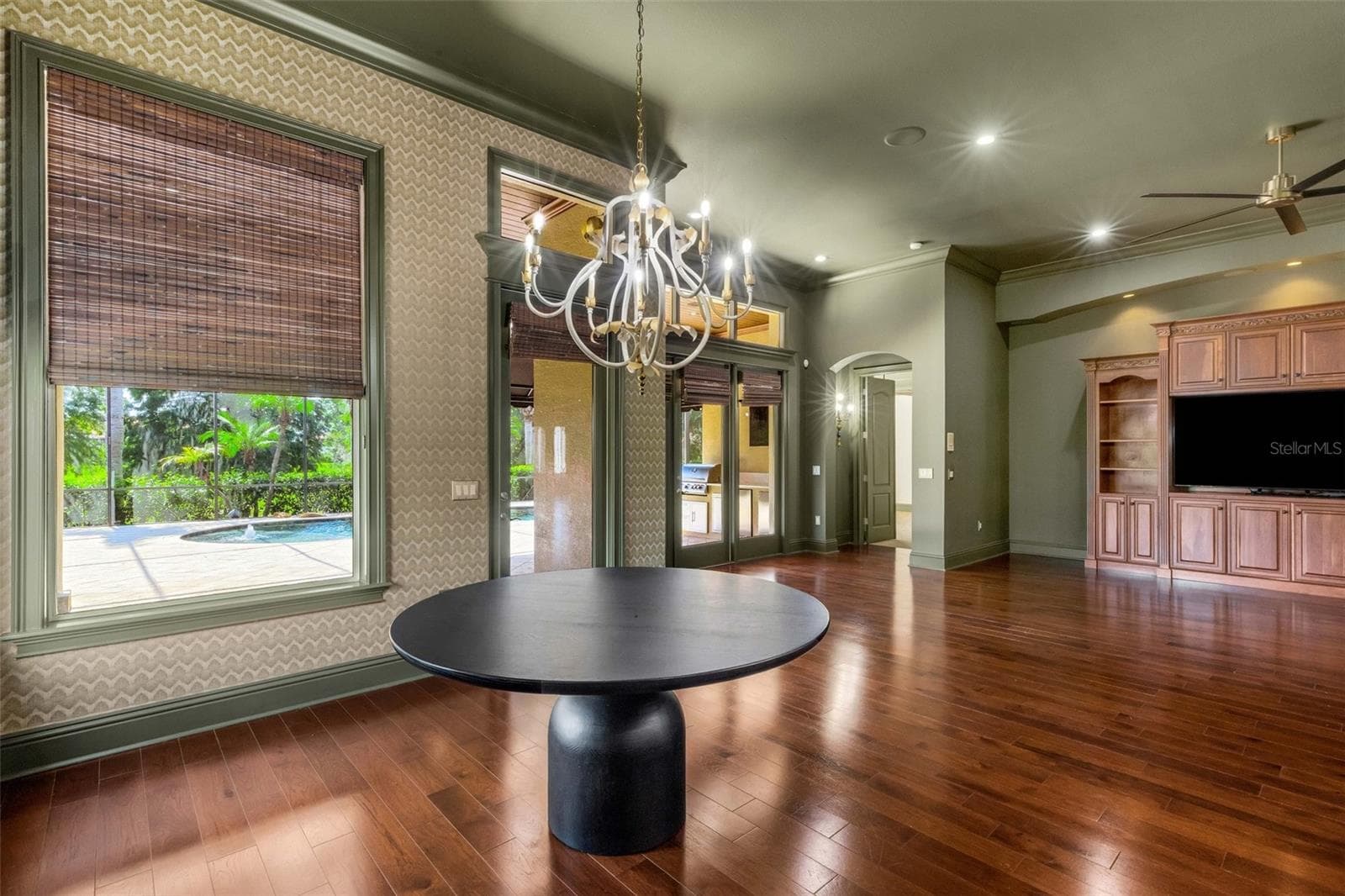 Large windows flood the space with golden natural light. - 2734 BELLERIVE DR, LAKELAND