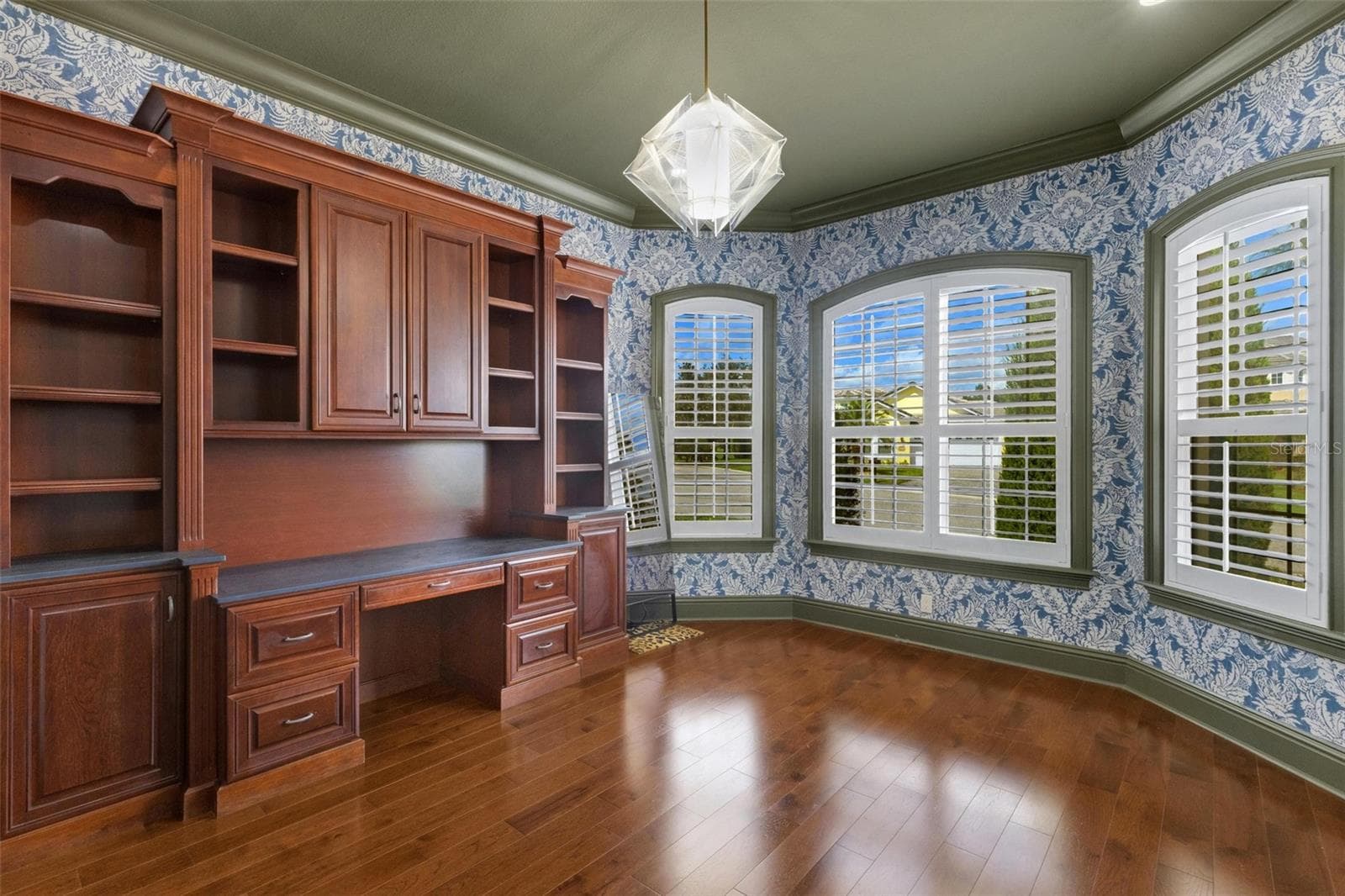 But there is still space for a desk, worktable, and a full wall of windows overlooking the front of the property. - 2734 BELLERIVE DR, LAKELAND