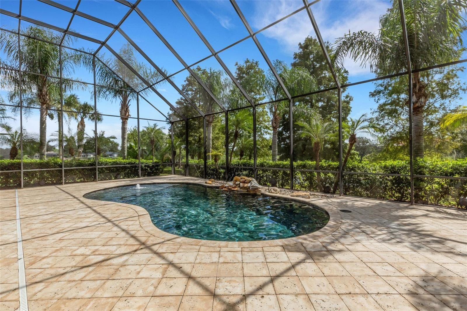 Completely screen enclosed by a 2-story structure. - 2734 BELLERIVE DR, LAKELAND