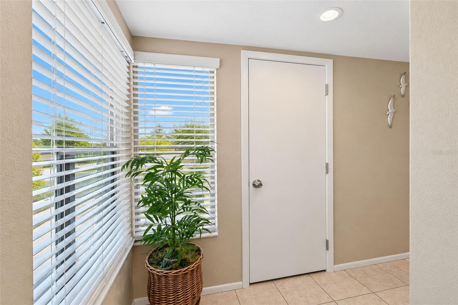 The front entry has tiled flooring and natural light. - 2950 N BEACH RD #A321, ENGLEWOOD