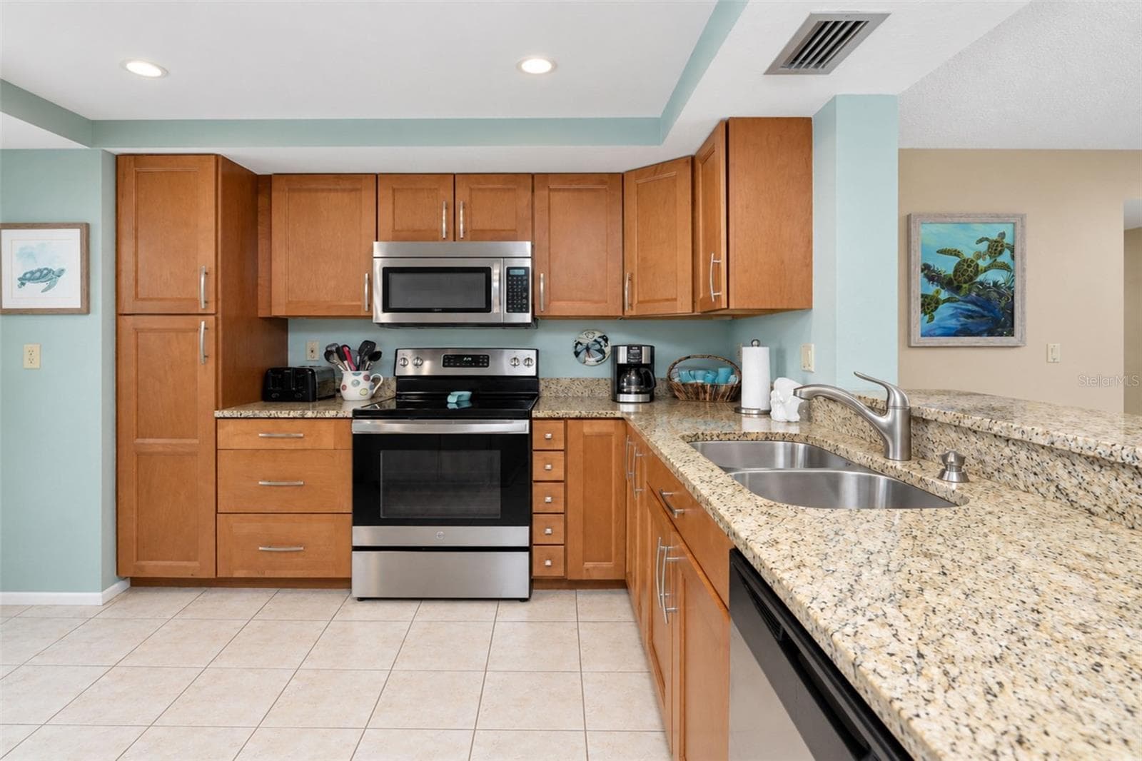 The kitchen features a GE stove, Frigidaire dishwasher and a Whirlpool microwave...all stainless steel! - 2950 N BEACH RD #A321, ENGLEWOOD