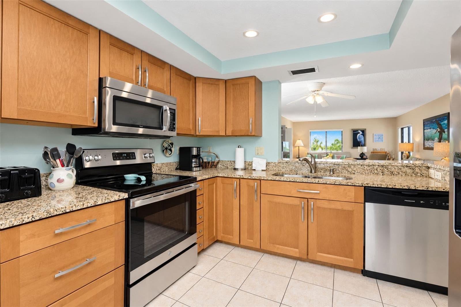 The maple cabinetry and granite countertop is very pretty! - 2950 N BEACH RD #A321, ENGLEWOOD
