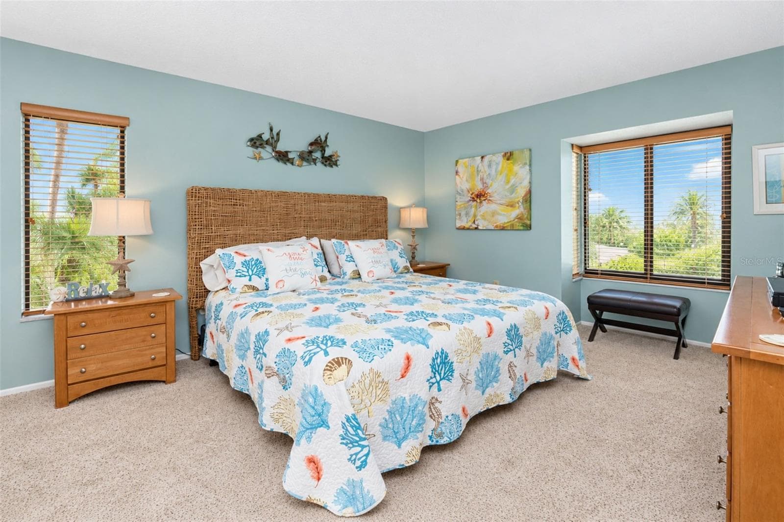 The primary bedroom features carpeted flooring and natural light. - 2950 N BEACH RD #A321, ENGLEWOOD