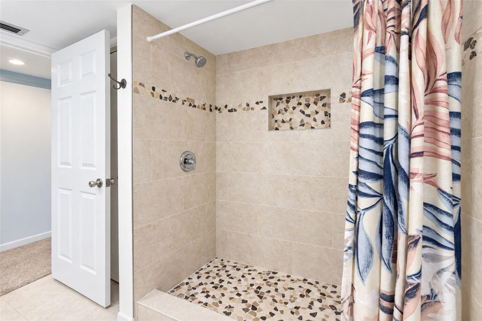 The primary bathroom features an updated shower. - 2950 N BEACH RD #A321, ENGLEWOOD