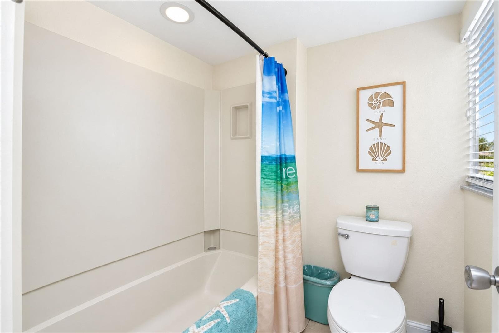 The guest bathroom has a tub/shower combo and a new toilet. - 2950 N BEACH RD #A321, ENGLEWOOD