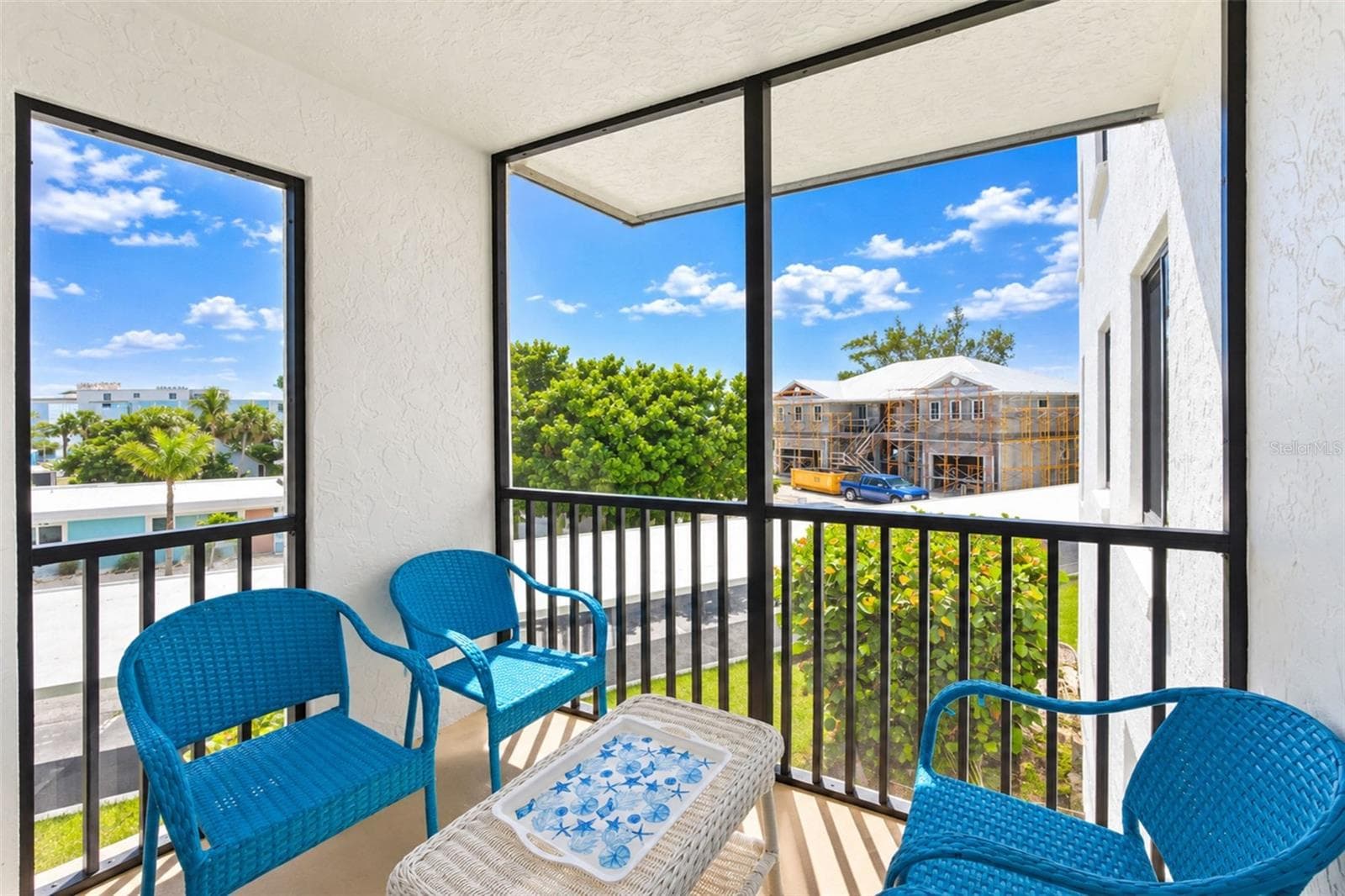 The screened lanai is a nice spot for morning coffee. - 2950 N BEACH RD #A321, ENGLEWOOD