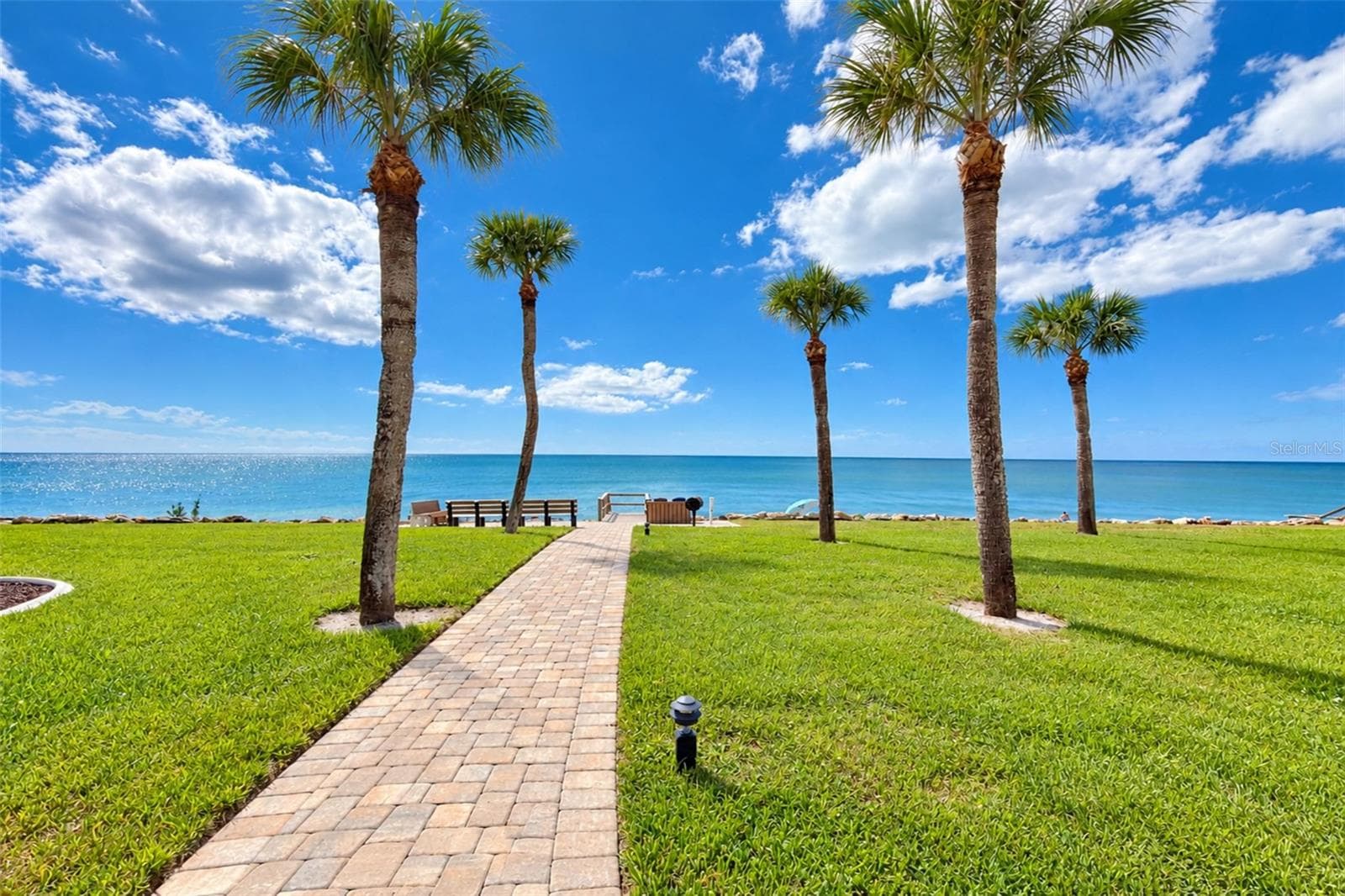 Walkway to the private beachfront seating area. - 2950 N BEACH RD #A321, ENGLEWOOD