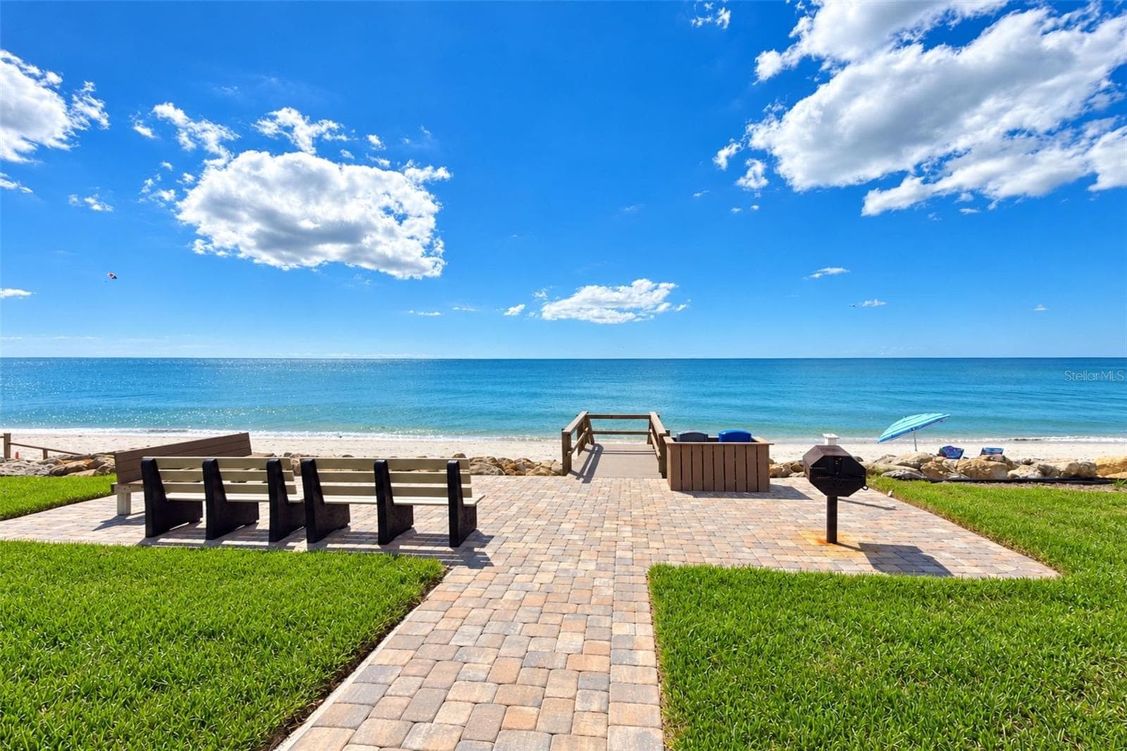 Grilling area with steps to the beach. - 2950 N BEACH RD #A321, ENGLEWOOD