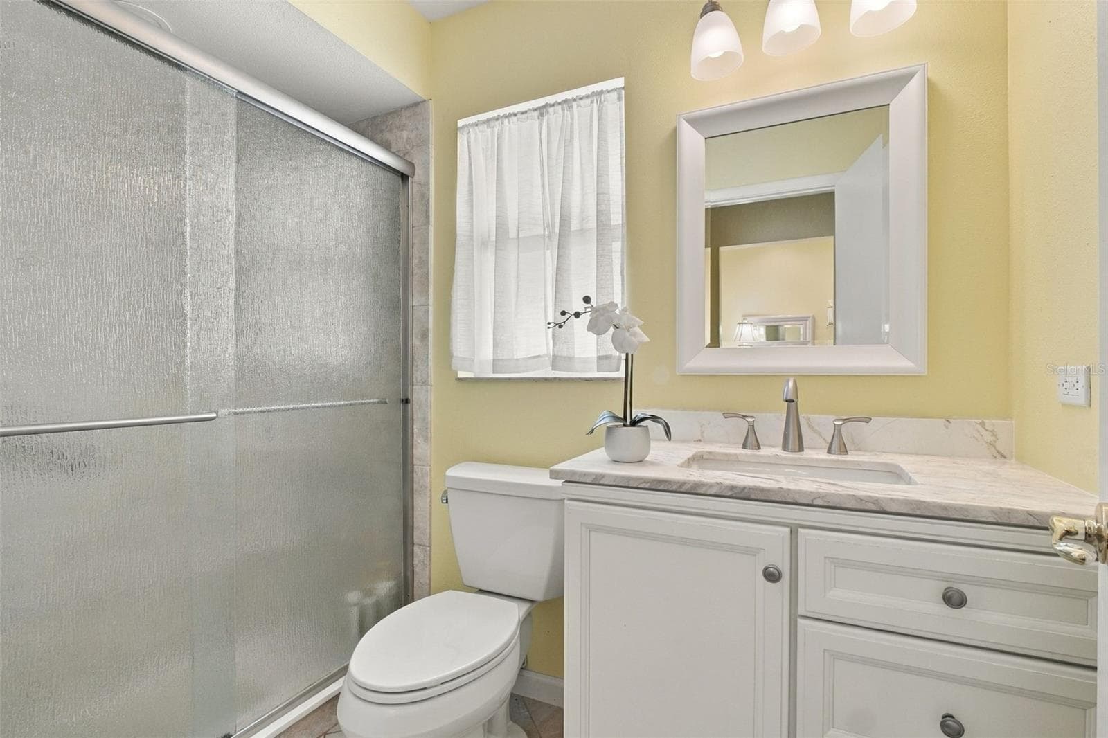 New vanity with stone top & beautiful glass enclosed walk-in shower~ - 1743 MACDONNELL DR, PALM HARBOR