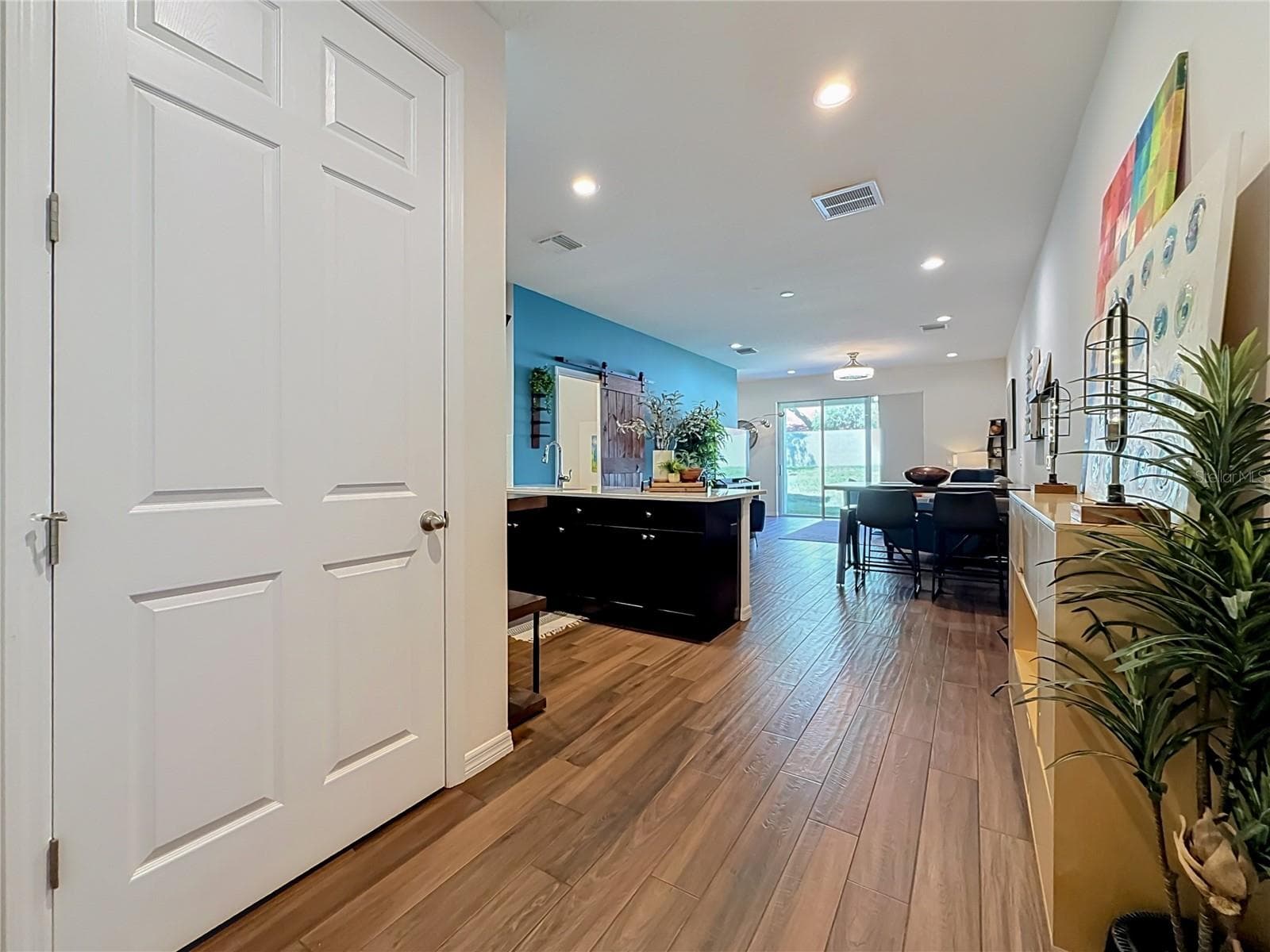Step inside to discover a spacious OPEN FLOOR PLAN with soaring ceilings and beautiful WOOD-LOOK TILE flooring throughout the downstairs living areas. - 2270 MONTVIEW DR, CLEARWATER