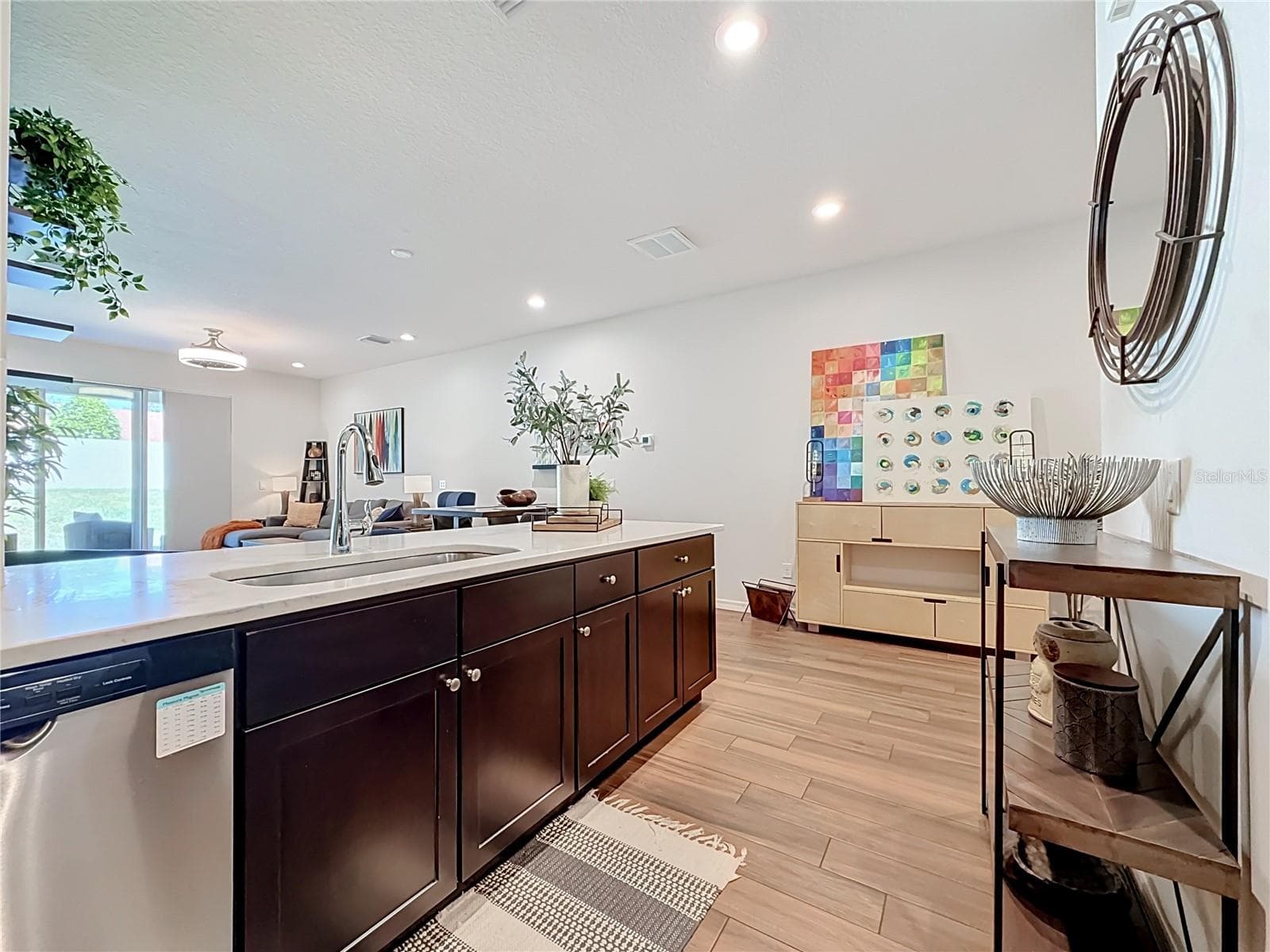 The seamless flow between the kitchen, living, and dining areas makes entertaining a breeze - 2270 MONTVIEW DR, CLEARWATER