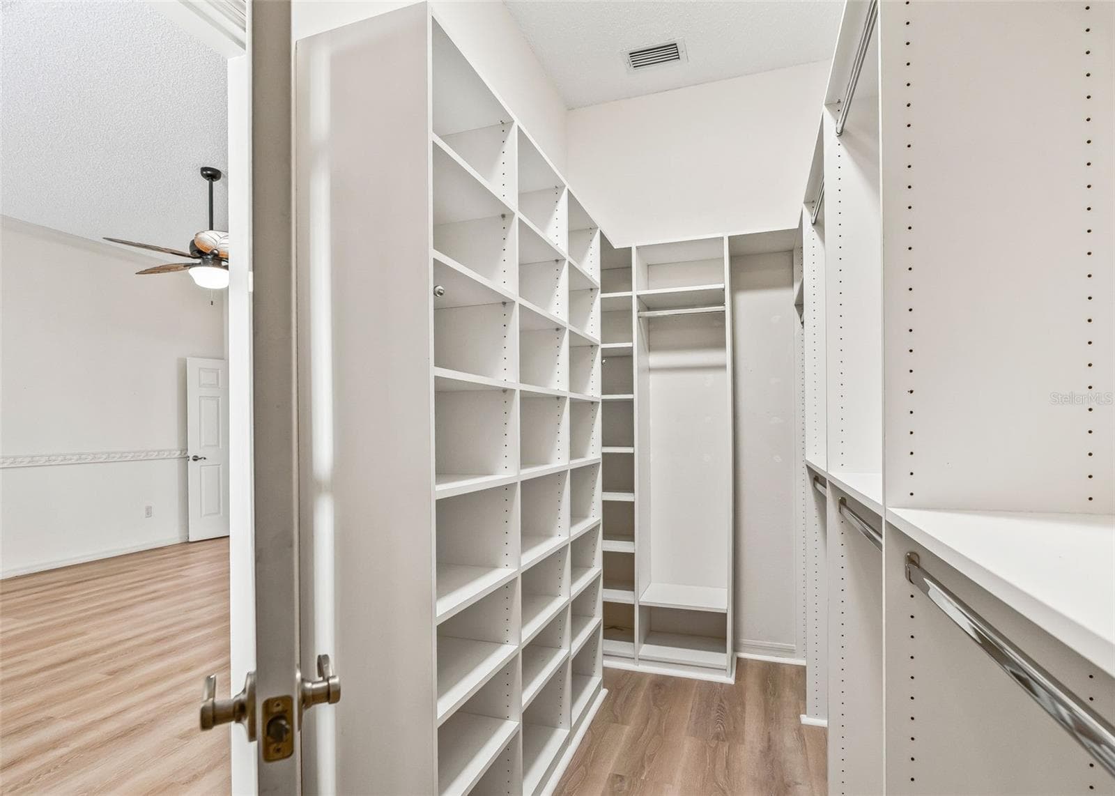 Primary Walk-In Closet w/ Organizers & Solar Tube. - 2762 MORVEN PARK WAY, THE VILLAGES