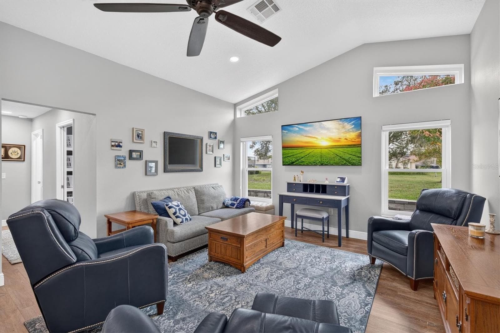 Family Room with Vaulted Ceiling & Transom Windows - 8185 SPANISH OAK DR, SPRING HILL