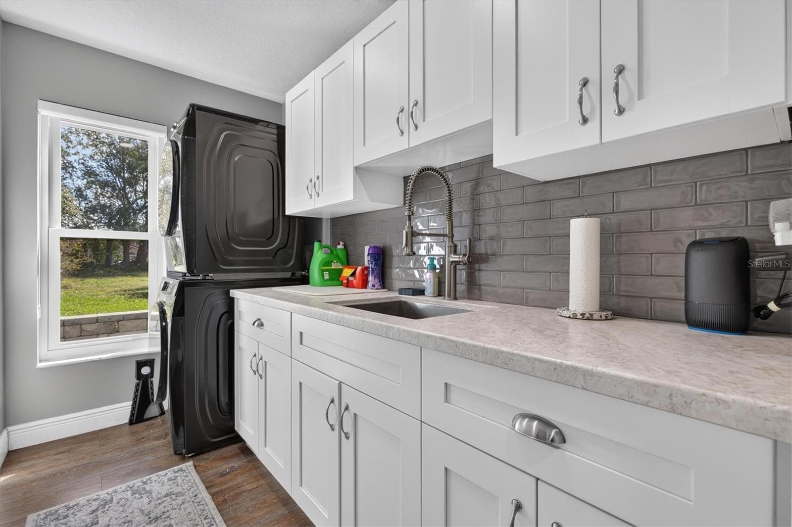 Updated Laundry Room with lots of Storage, Counter Space and a Sink - 8185 SPANISH OAK DR, SPRING HILL