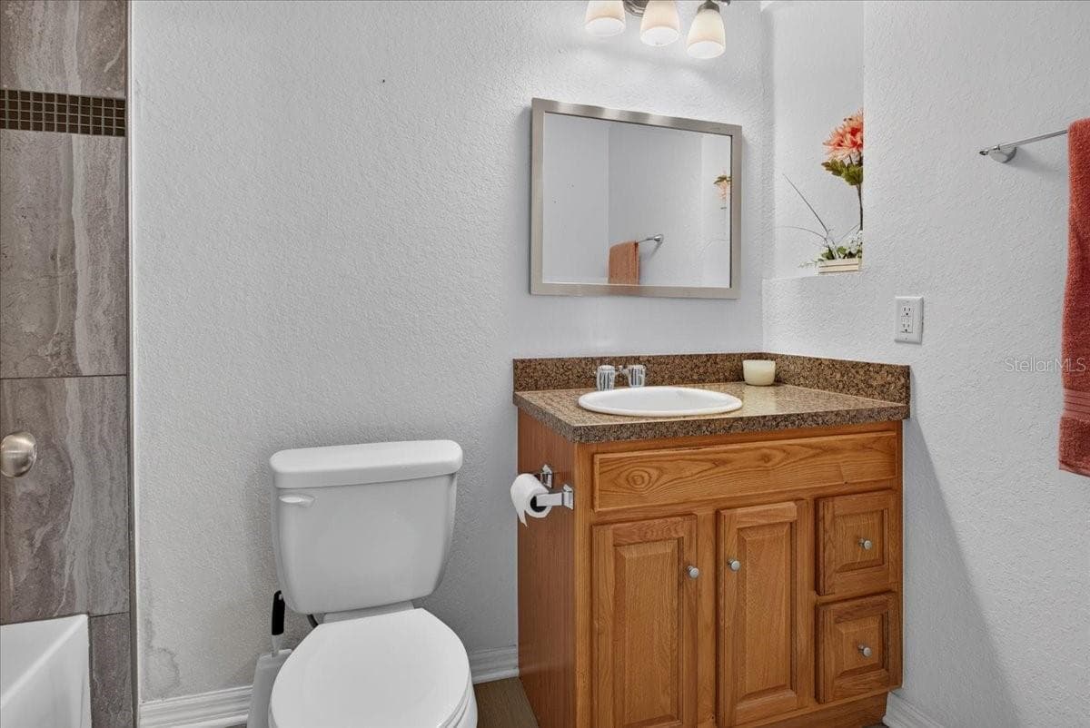 Primary bathroom with tub and tile shower - 24683 W US HIGHWAY 27, HIGH SPRINGS