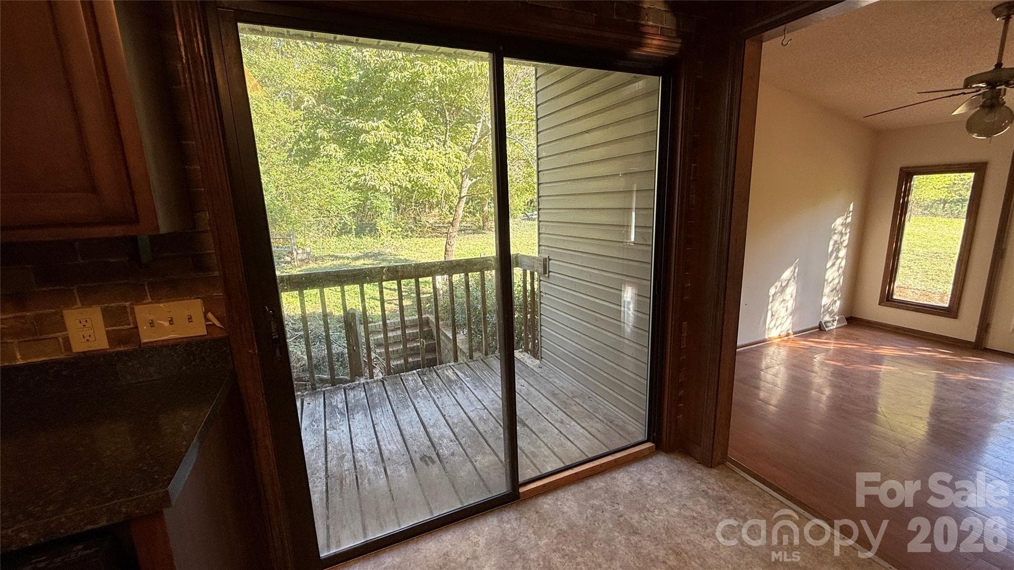 Kitchen, rear porch, and stepdown to Dining Room - 36934 Tercher Road, New London