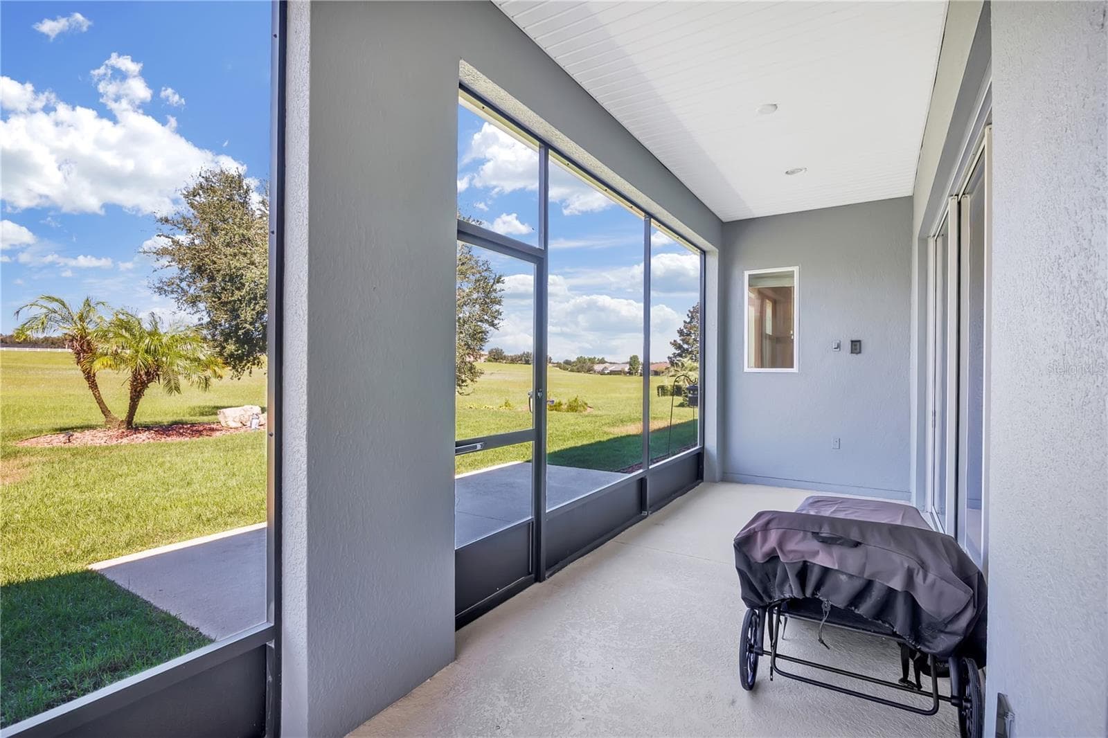 Covered and Screened Porch off Primary Bedroom - 103 BALMY COAST RD, GROVELAND
