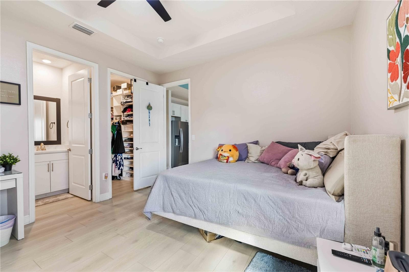 in-law suite bedroom with custom built-in closet shelving - 17604 BARLEY DR, LAKEWOOD RANCH