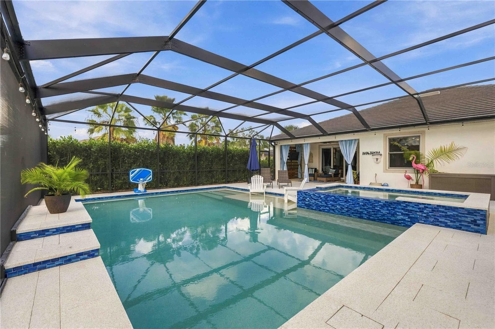 saltwater sports pool with 10 seater spa, featuring king + queen jets - 17604 BARLEY DR, LAKEWOOD RANCH