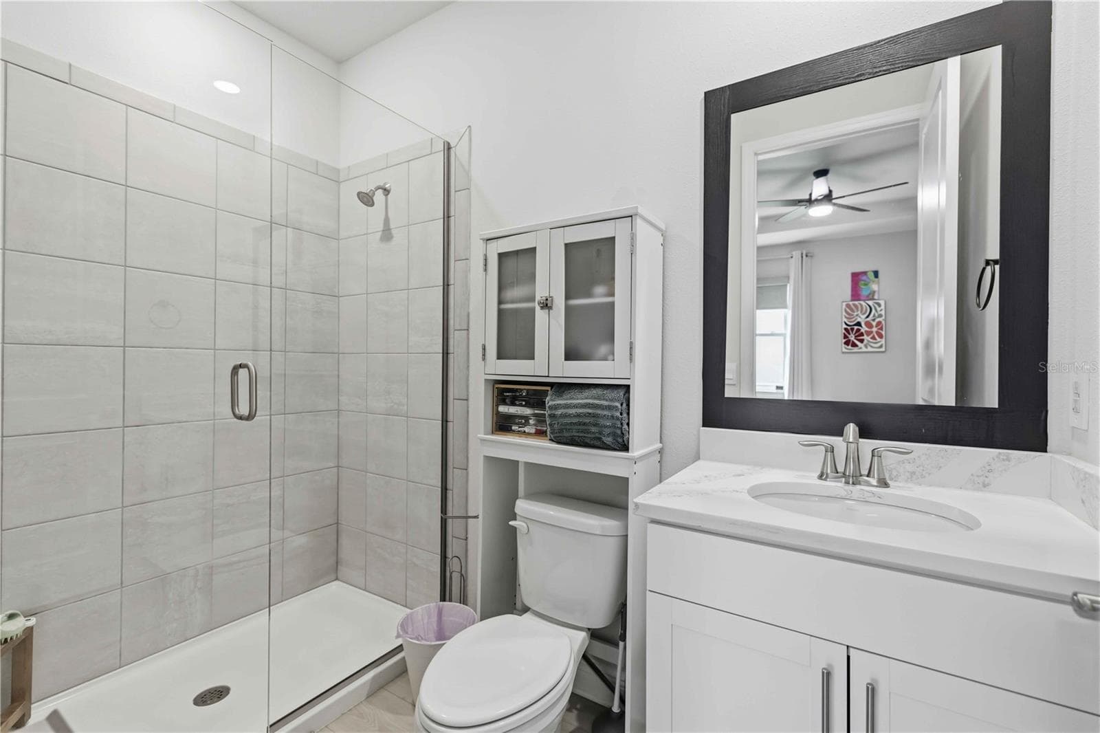 in-law suite bathroom with full walk-in shower & frameless enclosure - 17604 BARLEY DR, LAKEWOOD RANCH
