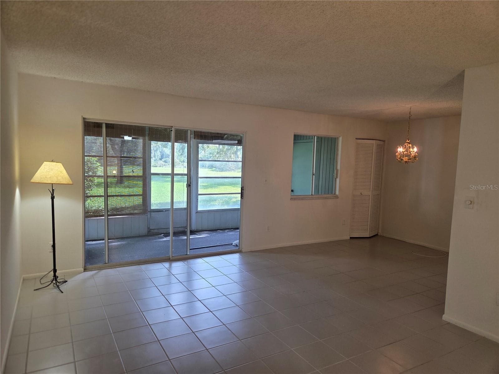 Living room and dining room - 610 MIDWAY DR #A, OCALA