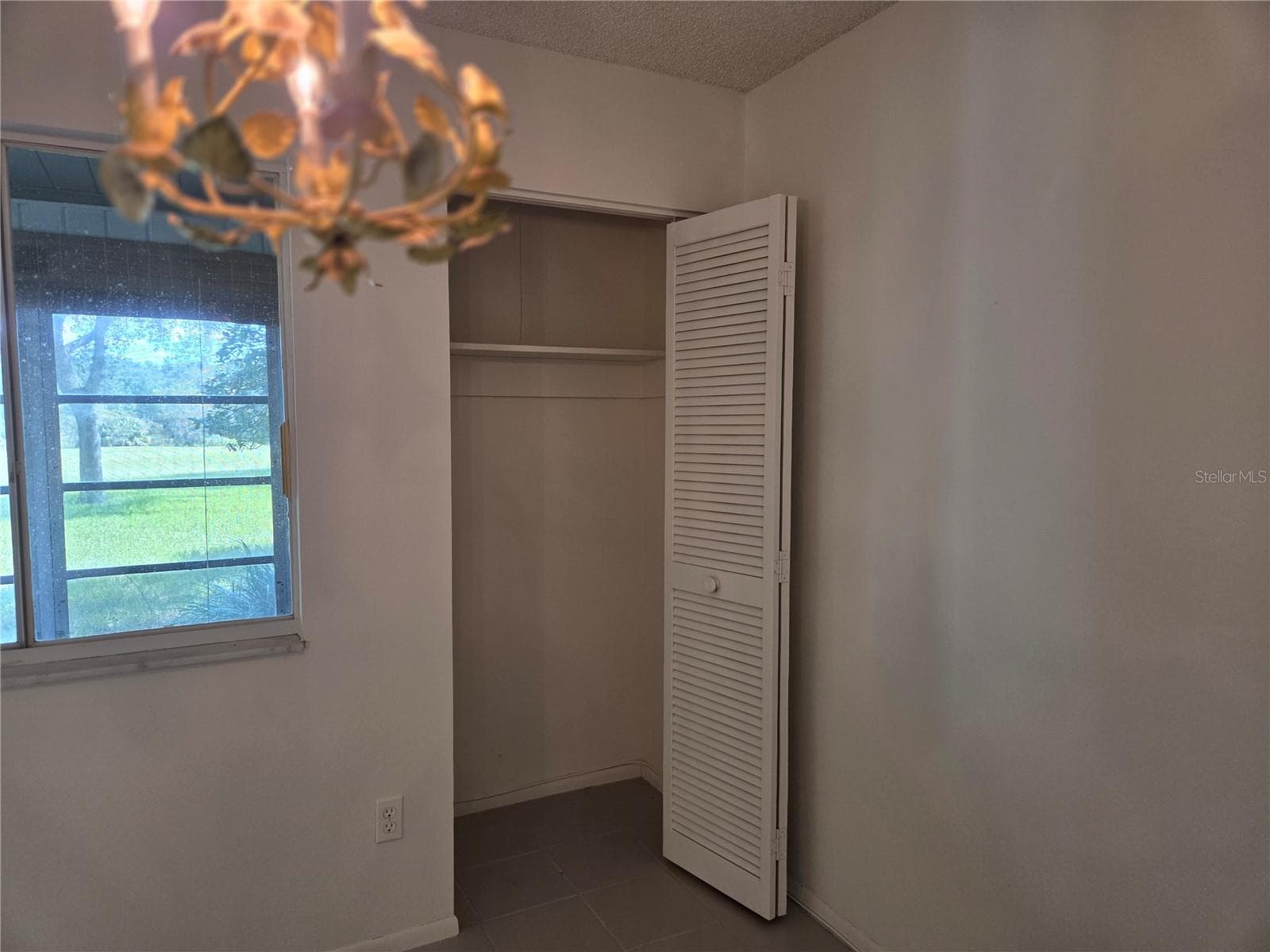 Living room storage closet - 610 MIDWAY DR #A, OCALA