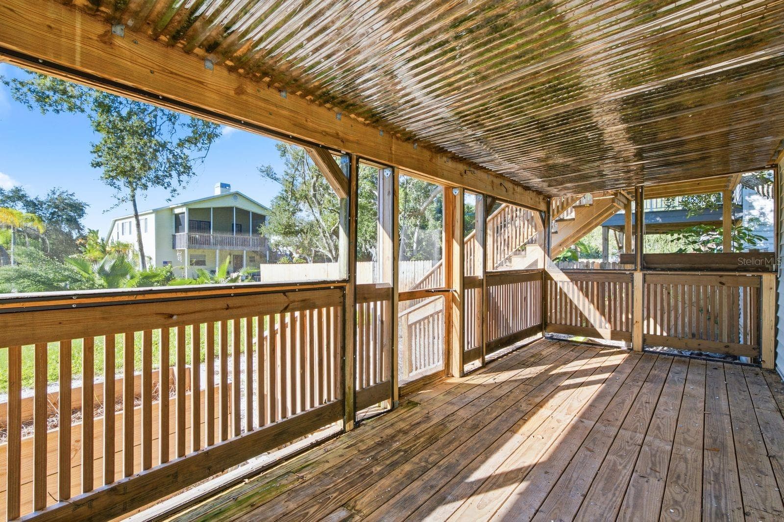 Lower level porch to backyard - 305 CRYSTAL BEACH AVE, CRYSTAL BEACH