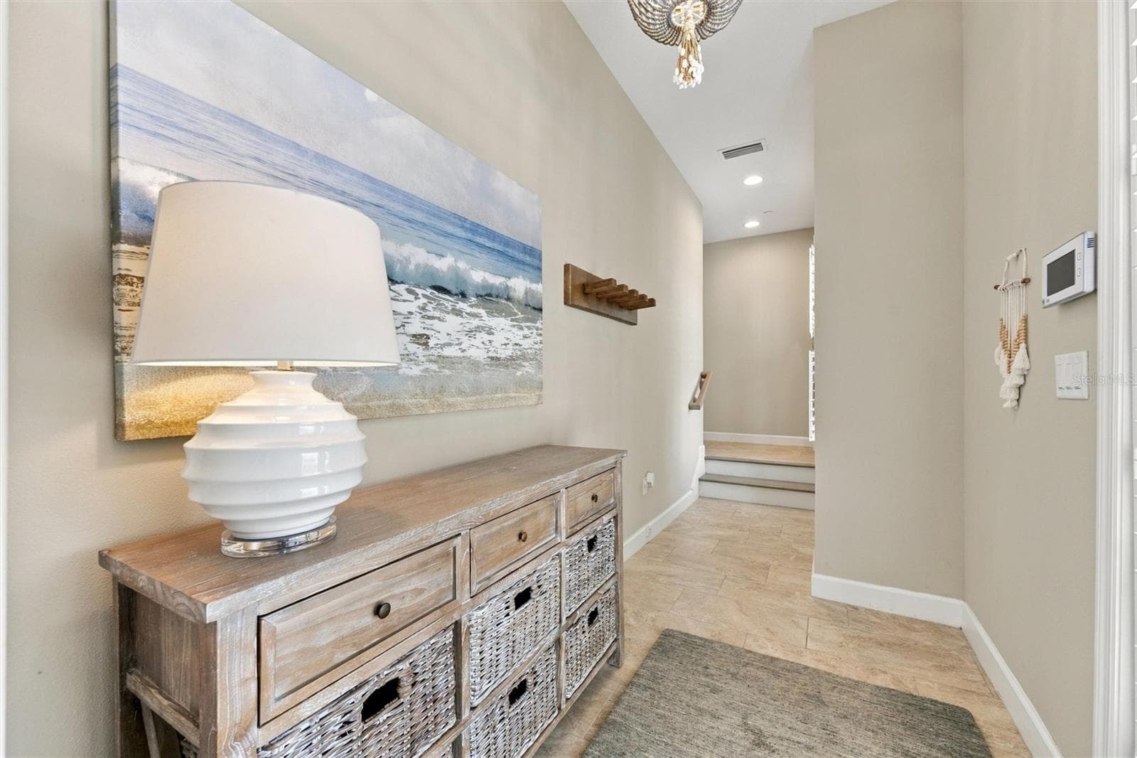 Welcome through the front entry, with convenient access to the second level by either stairs or elevator. - 291 COMPASS POINT DR #201, BRADENTON