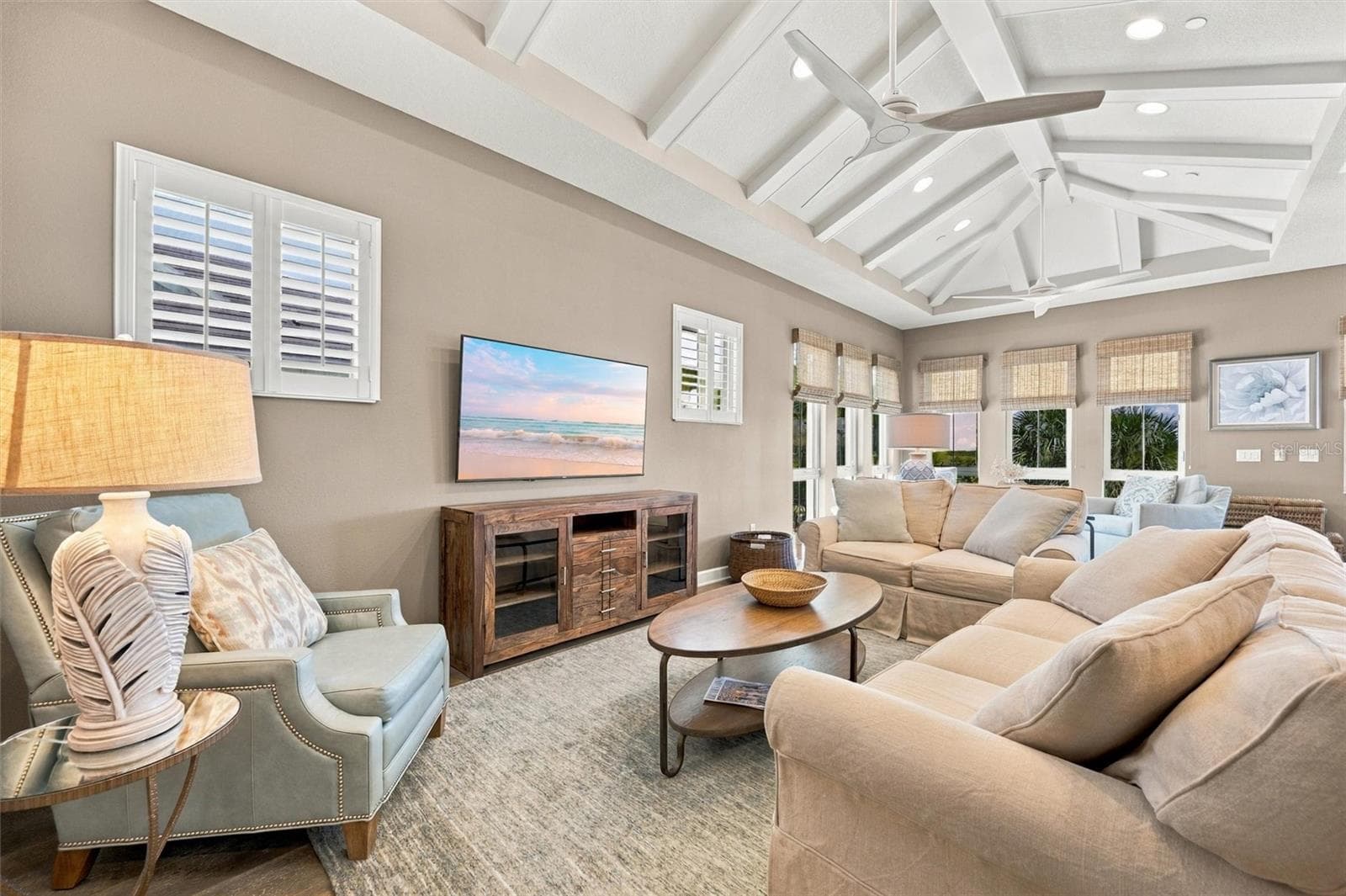 Enjoy peaceful Sapphire Lake views from this beautifully appointed home, featuring an open-concept floor plan, soaring vaulted ceilings, and Mohawk engineered hardwood flooring. - 291 COMPASS POINT DR #201, BRADENTON