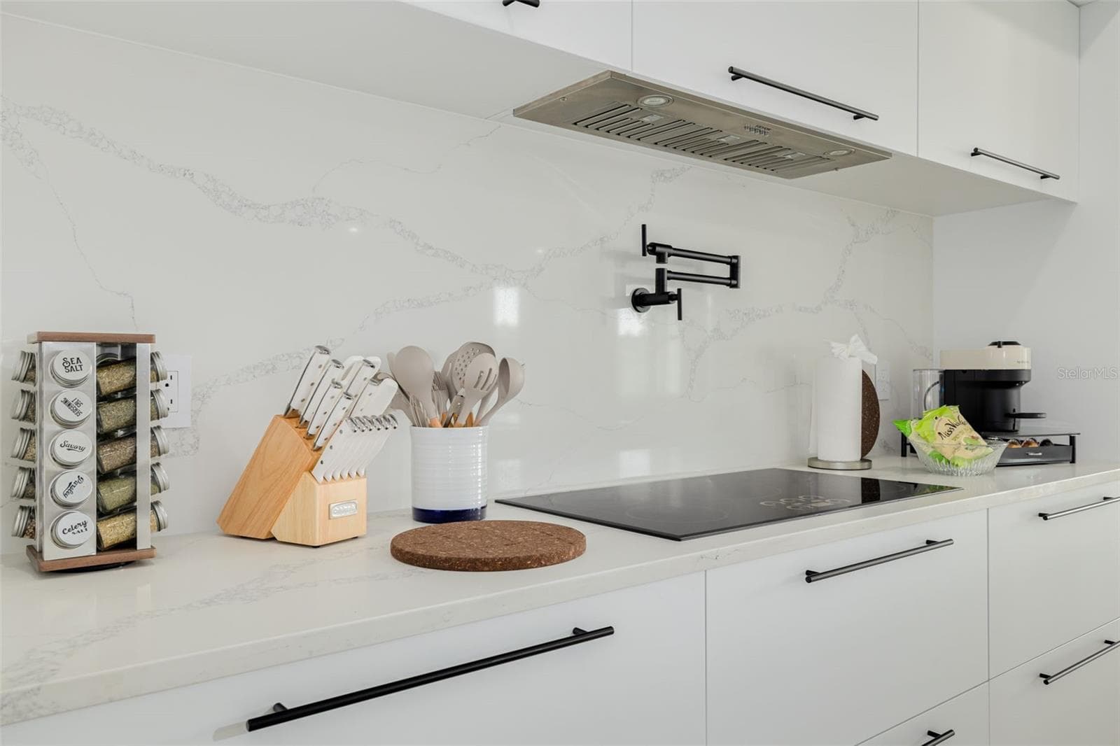 Pot filler and induction stove top. - 7609 DEEDRA CIR, PORT RICHEY