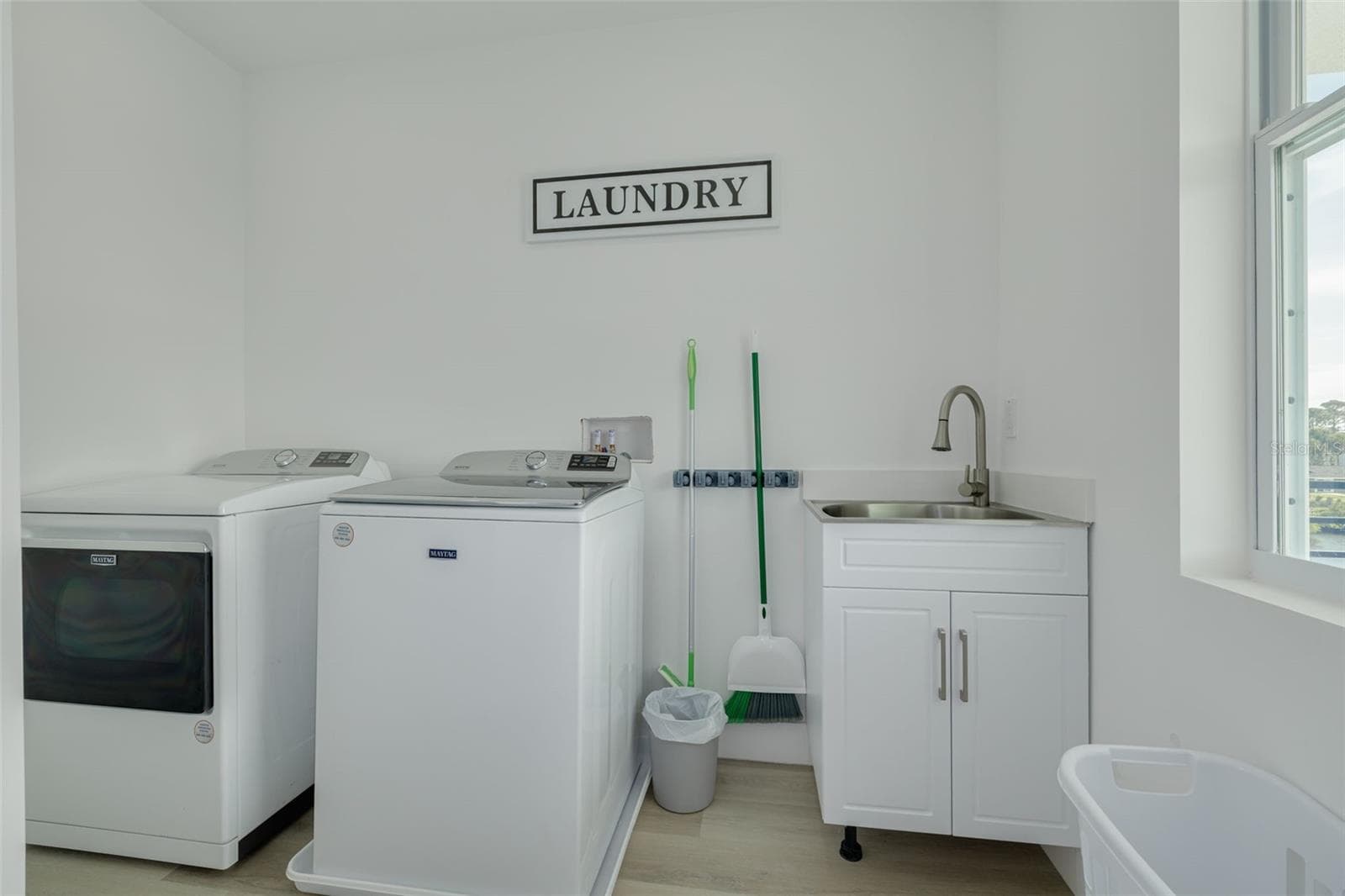 Laundry off loft area on the level with the three bedrooms. - 7609 DEEDRA CIR, PORT RICHEY