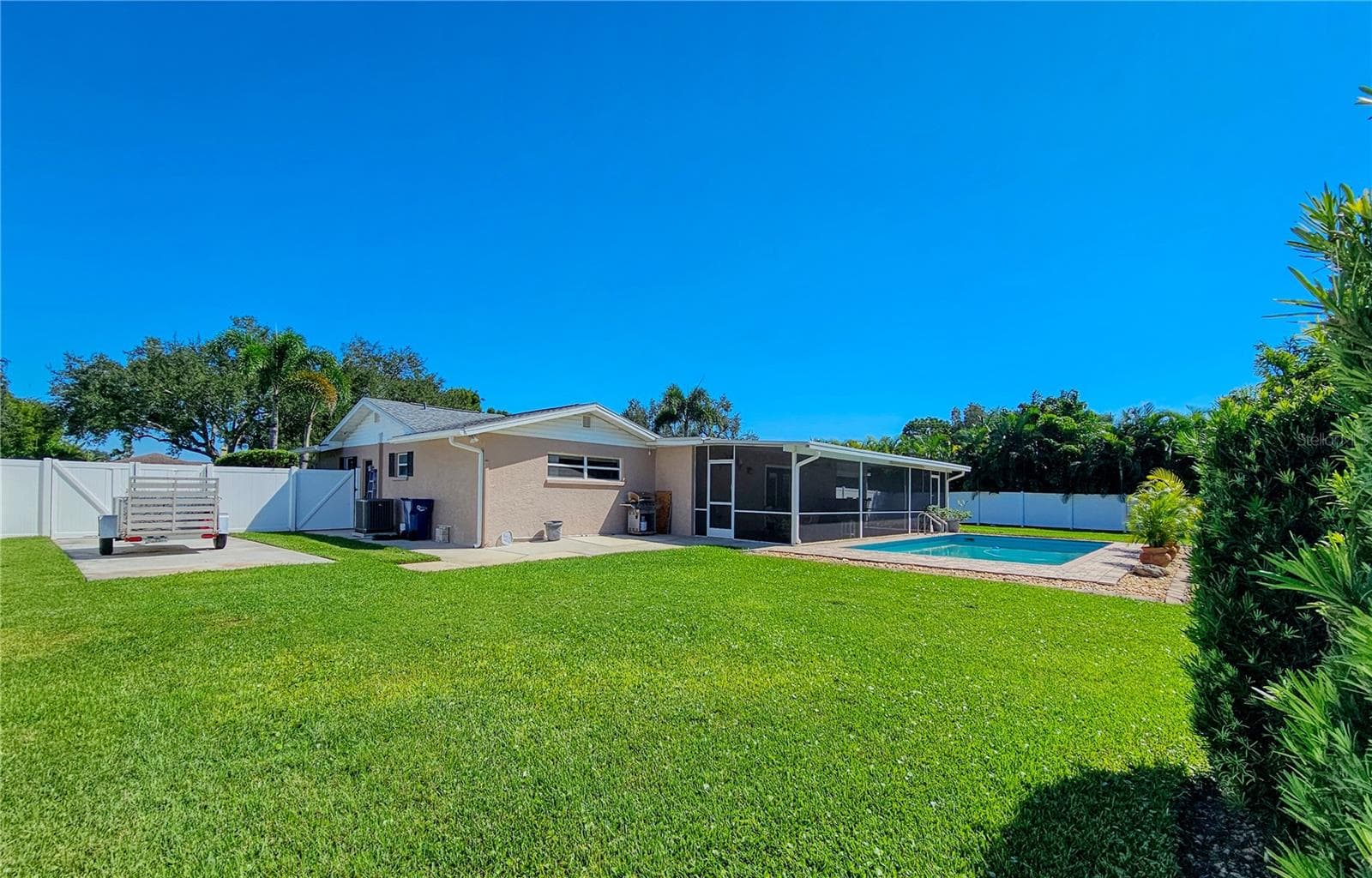 Fenced in Backyard from shed with RV/Boating parking pad behind double door fence - 2304 50TH ST W, BRADENTON