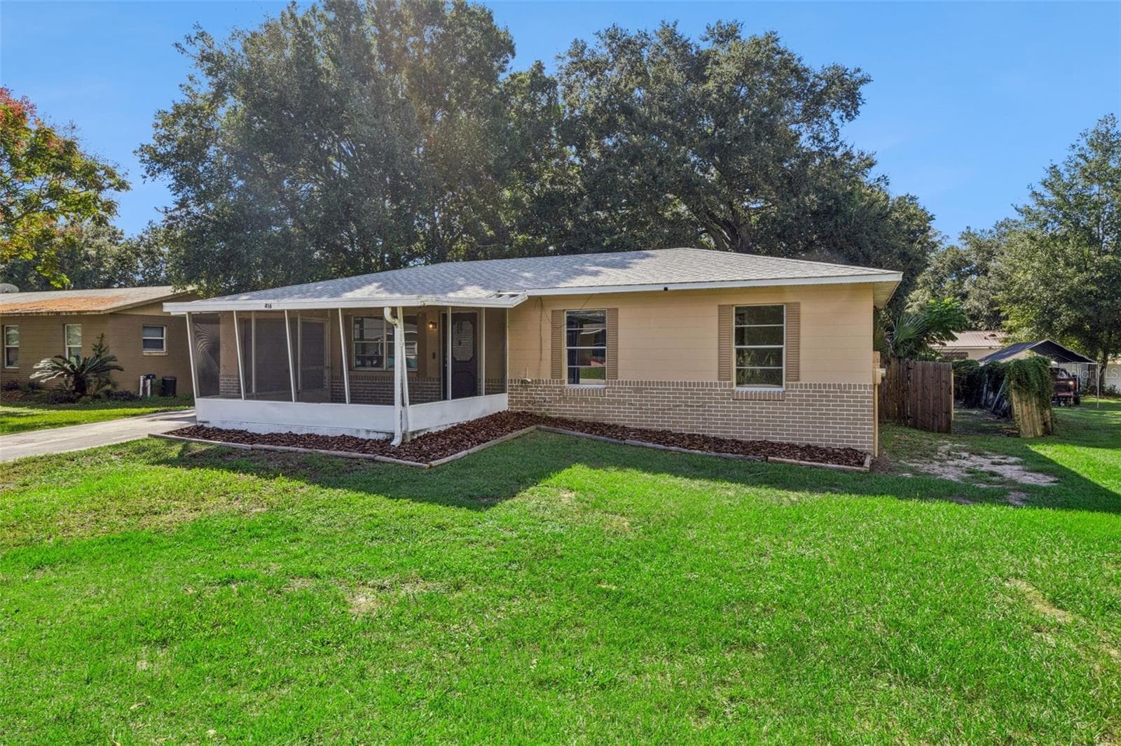 Block home with brick accents. - 416 WINNERS CIR, LADY LAKE