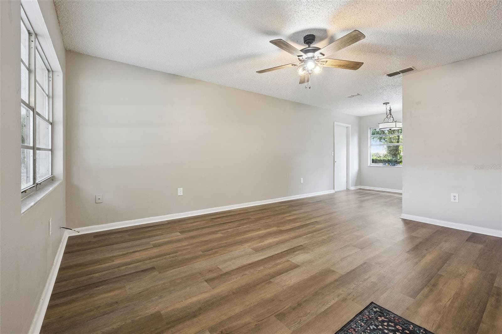 Living Room flows to Kitchen Dining. - 416 WINNERS CIR, LADY LAKE